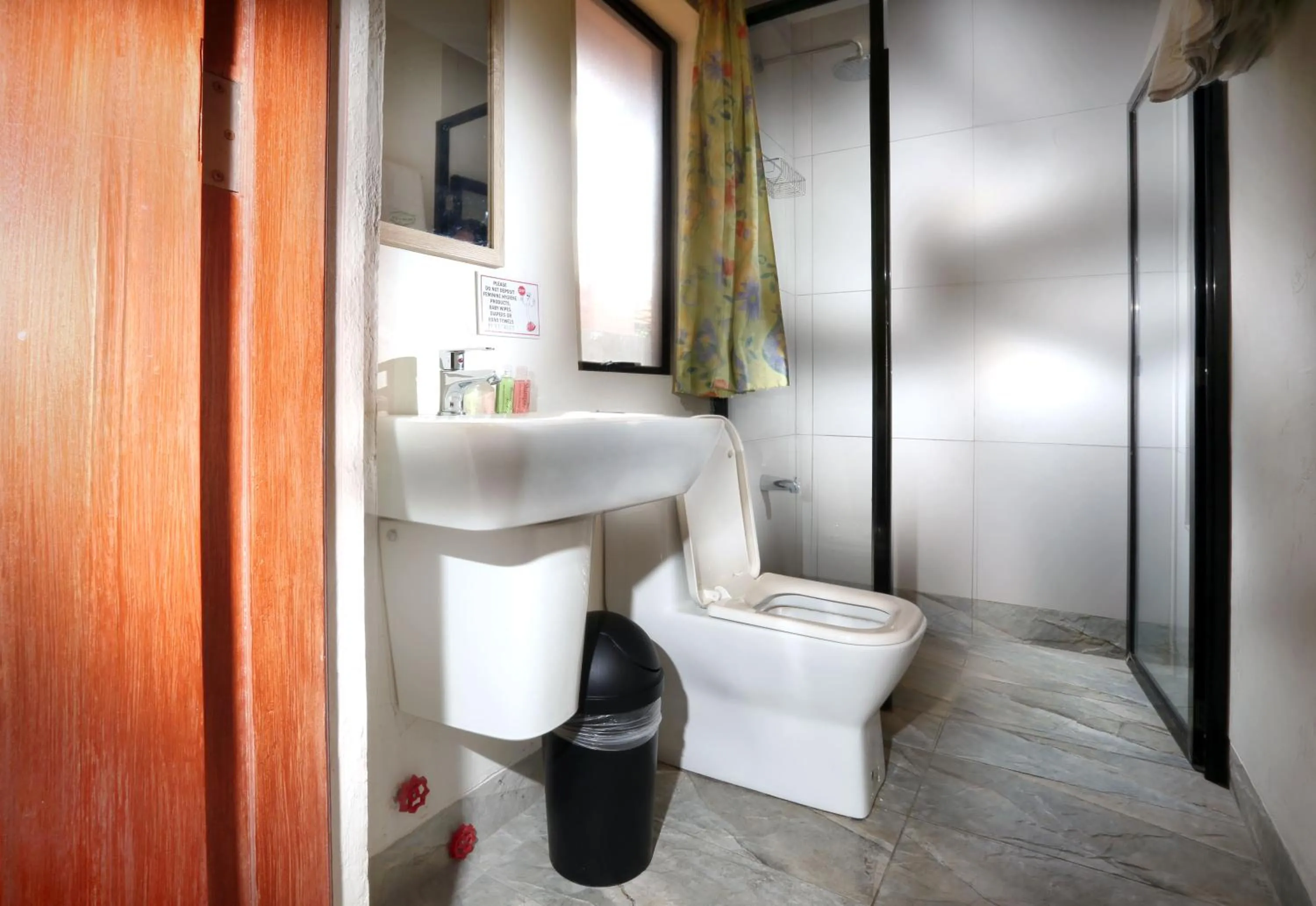 Toilet in 1775 Adriatico Suites