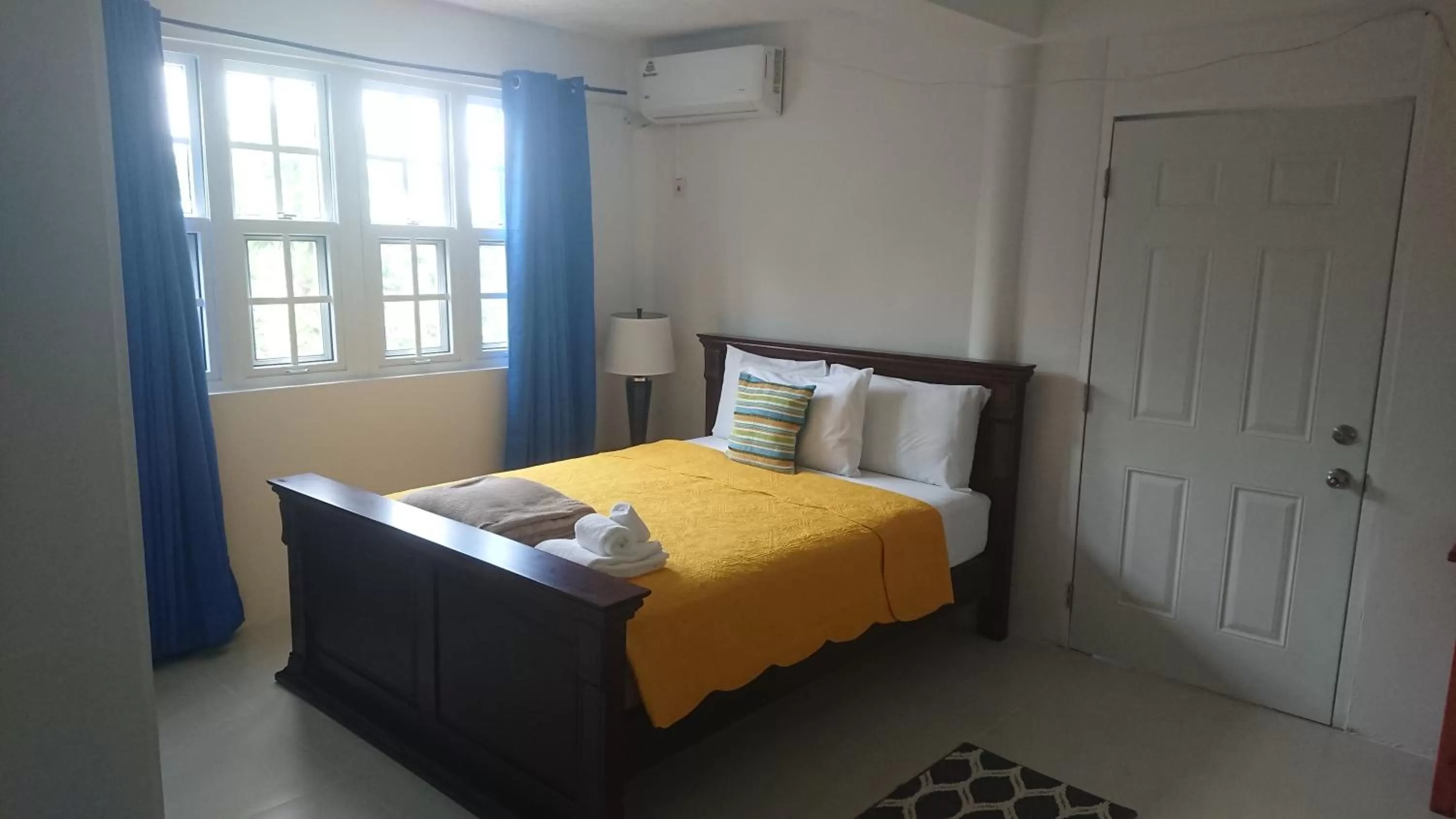 Bed in Classique International in Dominica