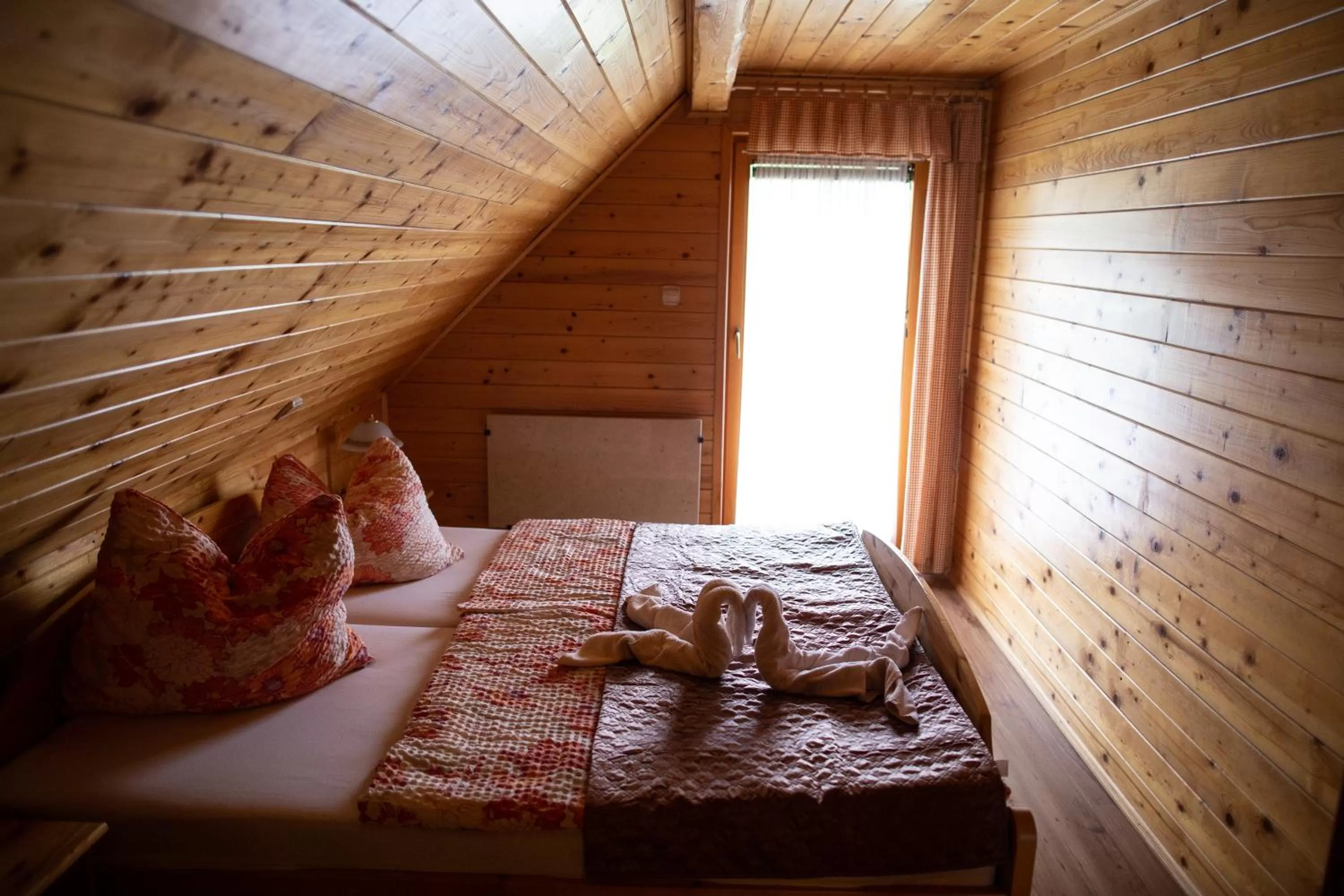 Bed in Korošec Apartments and Wellness Centre