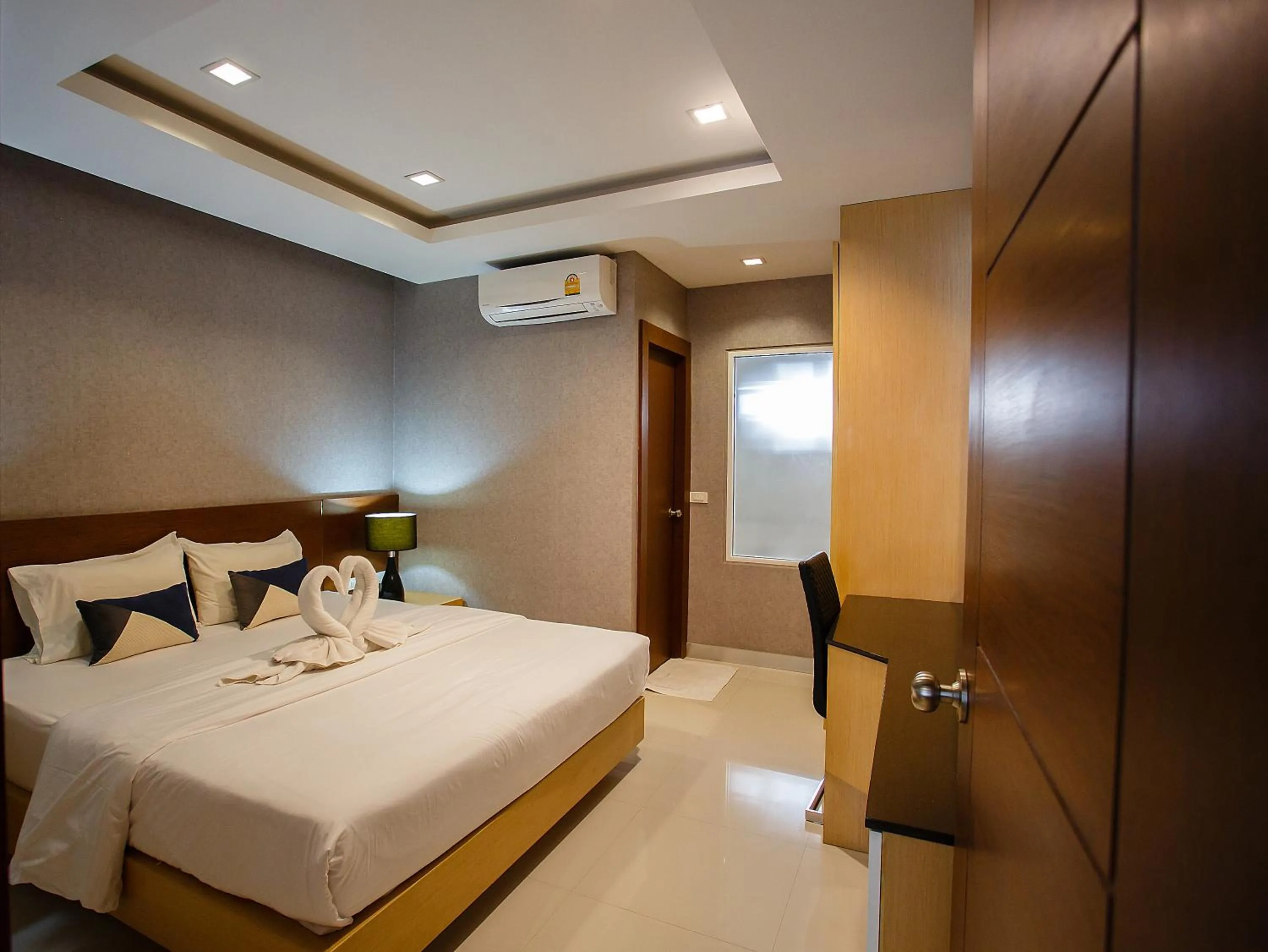 Bed in Platinum Hotel and Apartments