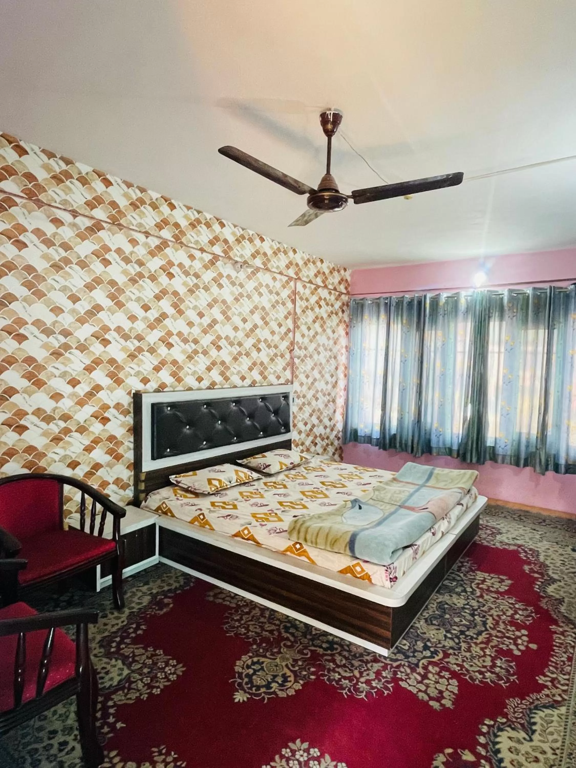 Bed, Seating Area in hotel new sahil