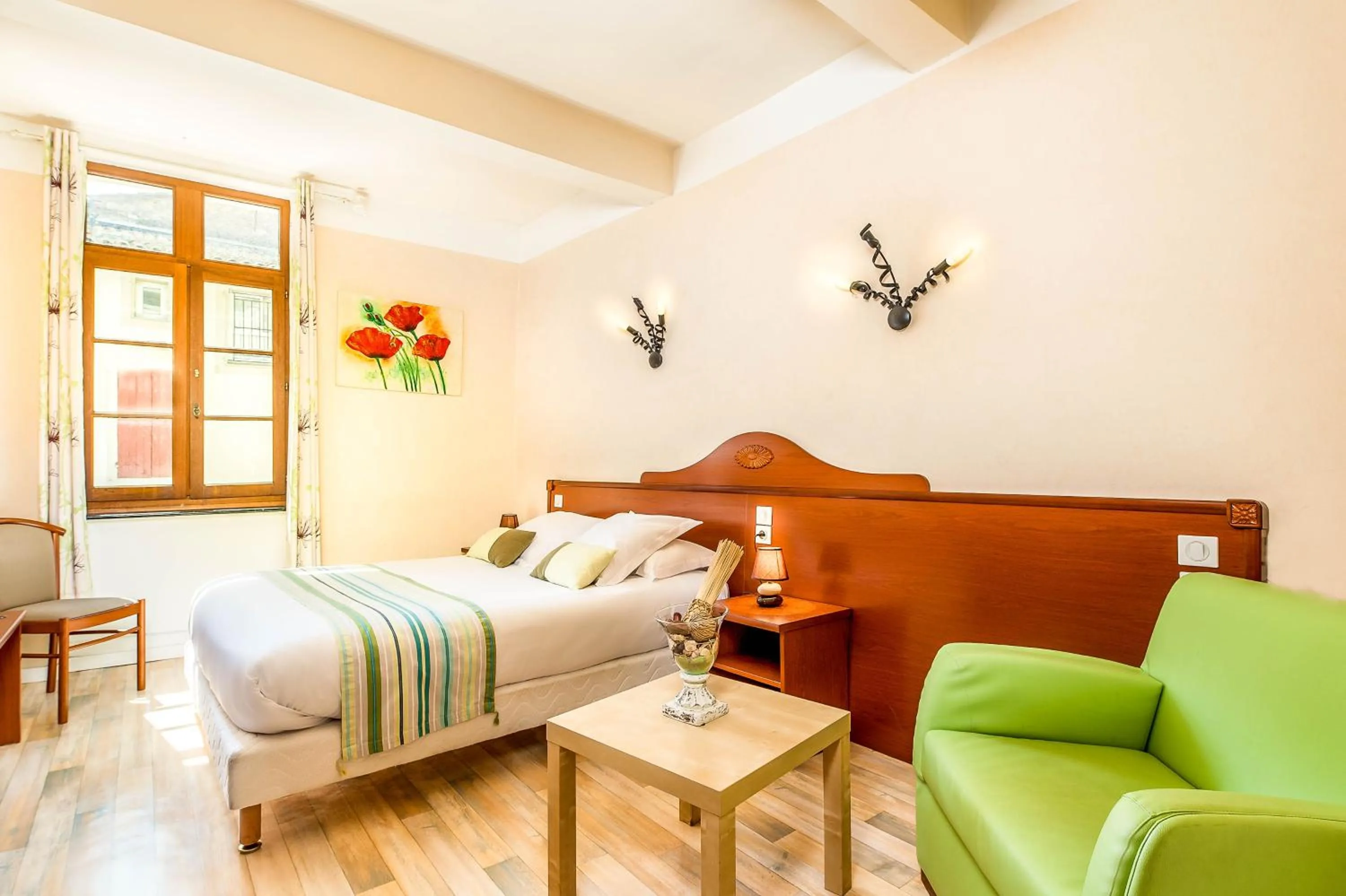 Living room, Bed in Logis Hôtel Restaurant Résidence