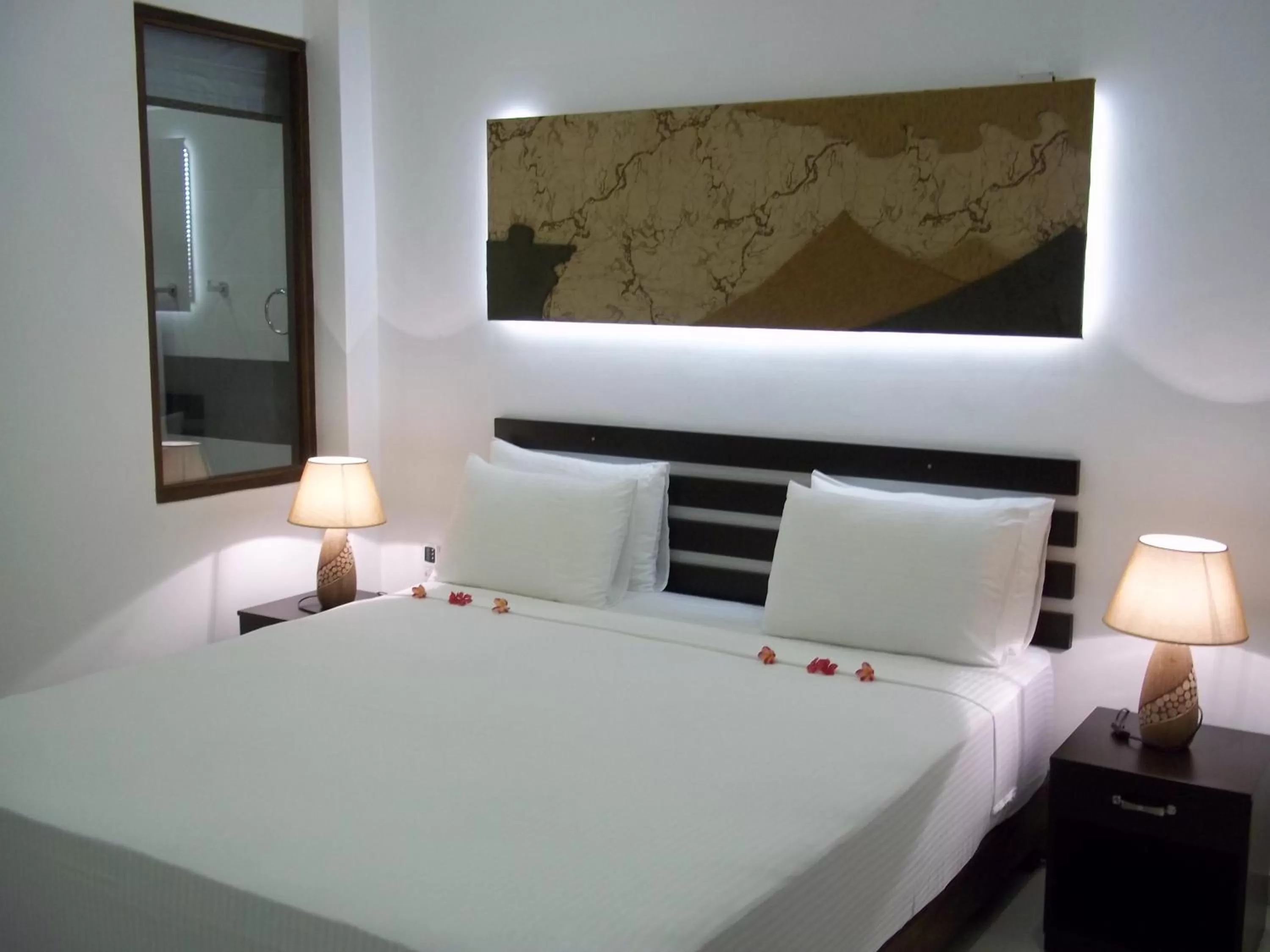 Bed in Sunrise Palace Negombo