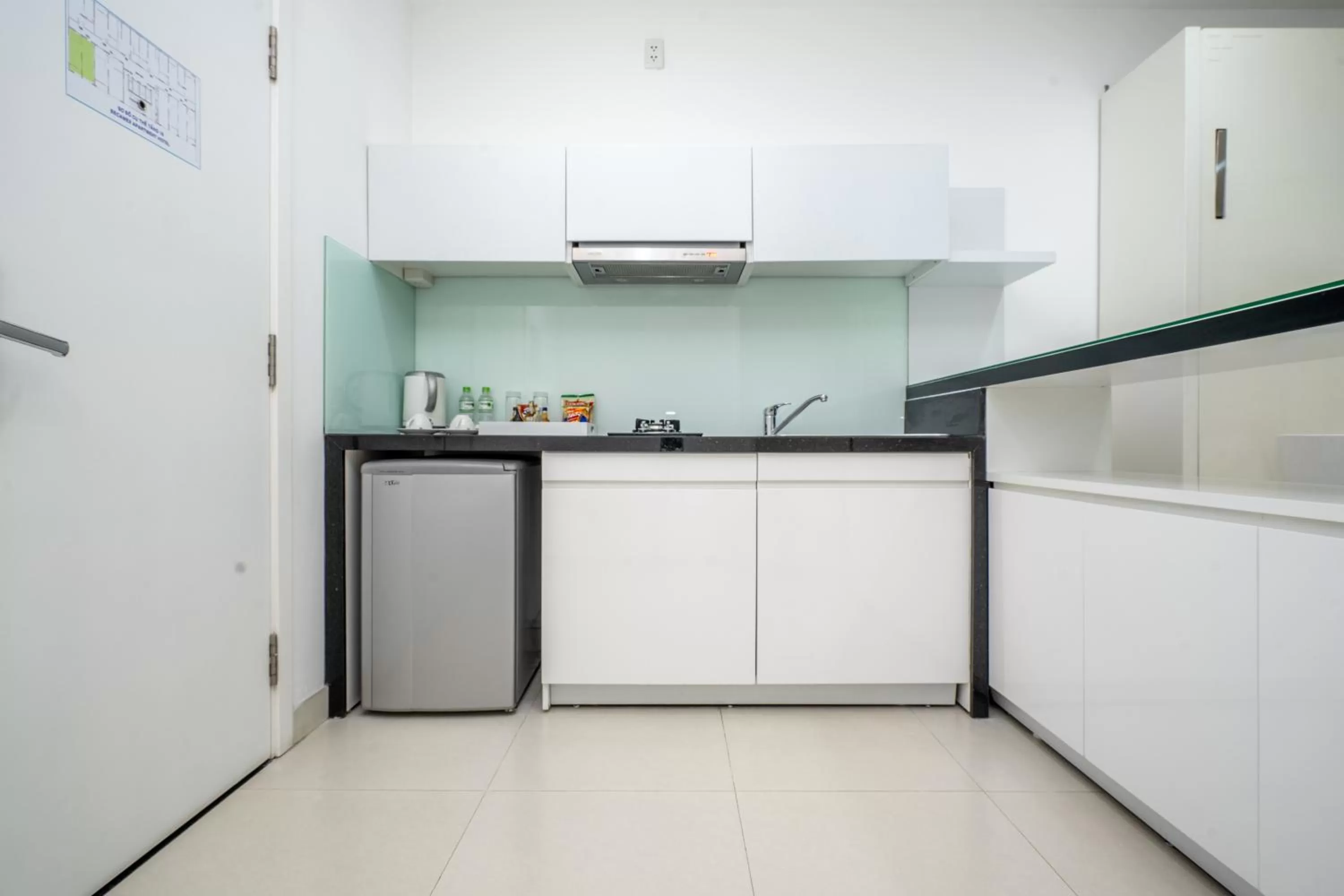 Kitchen or kitchenette in Becamex Hotel Thu Dau Mot