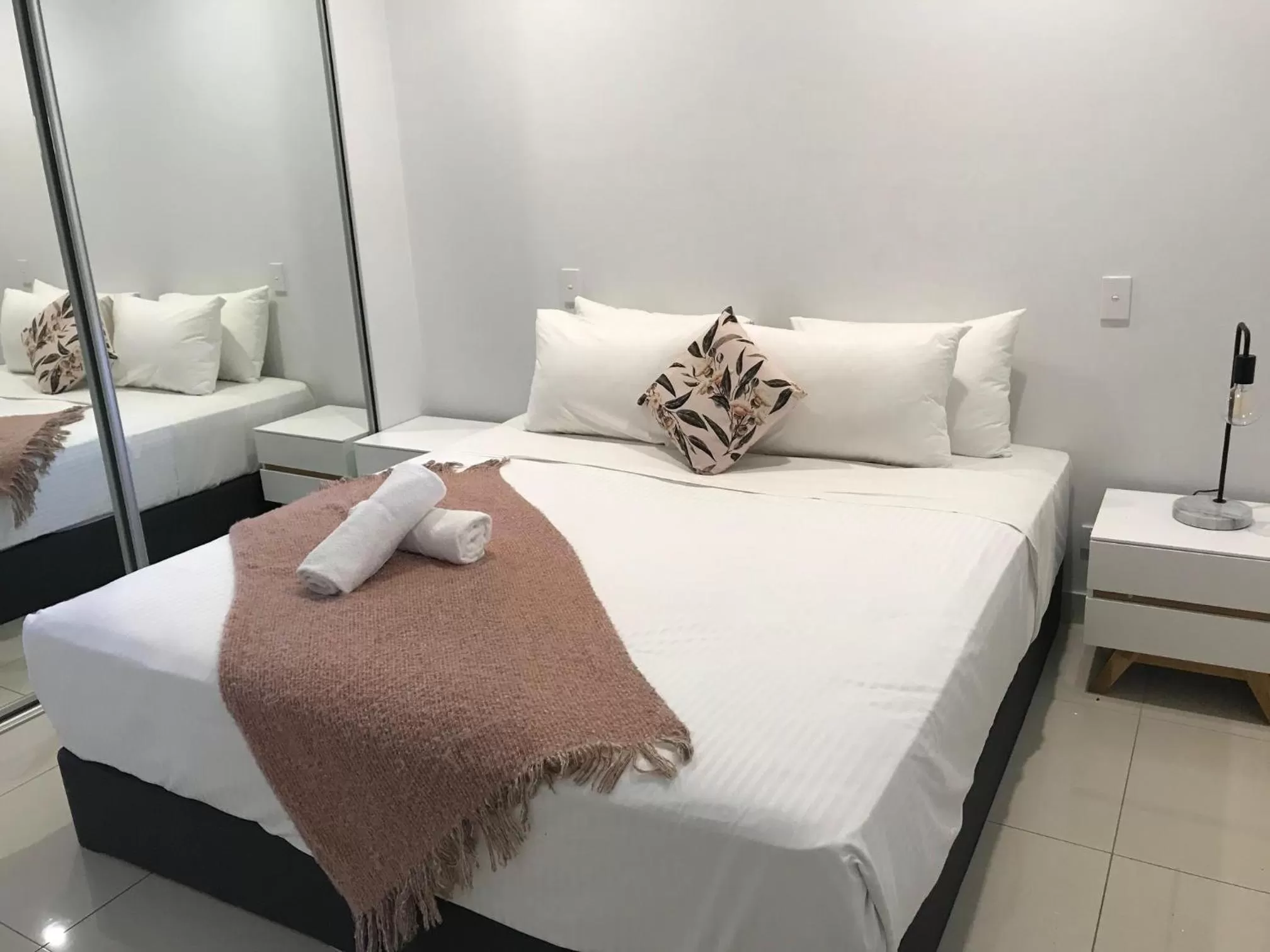 Bed in Magnum Serviced Apartments