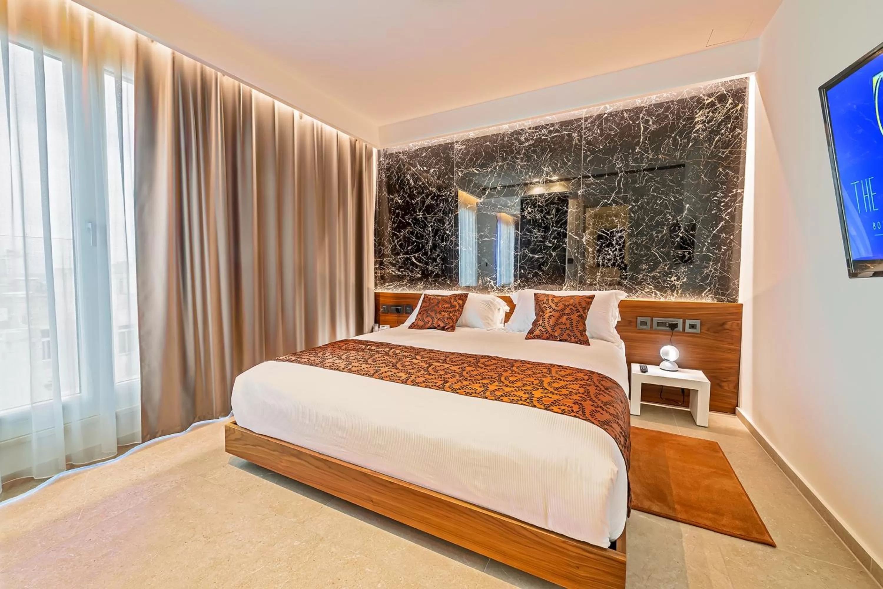 Bed in The Capital Boutique Hotel