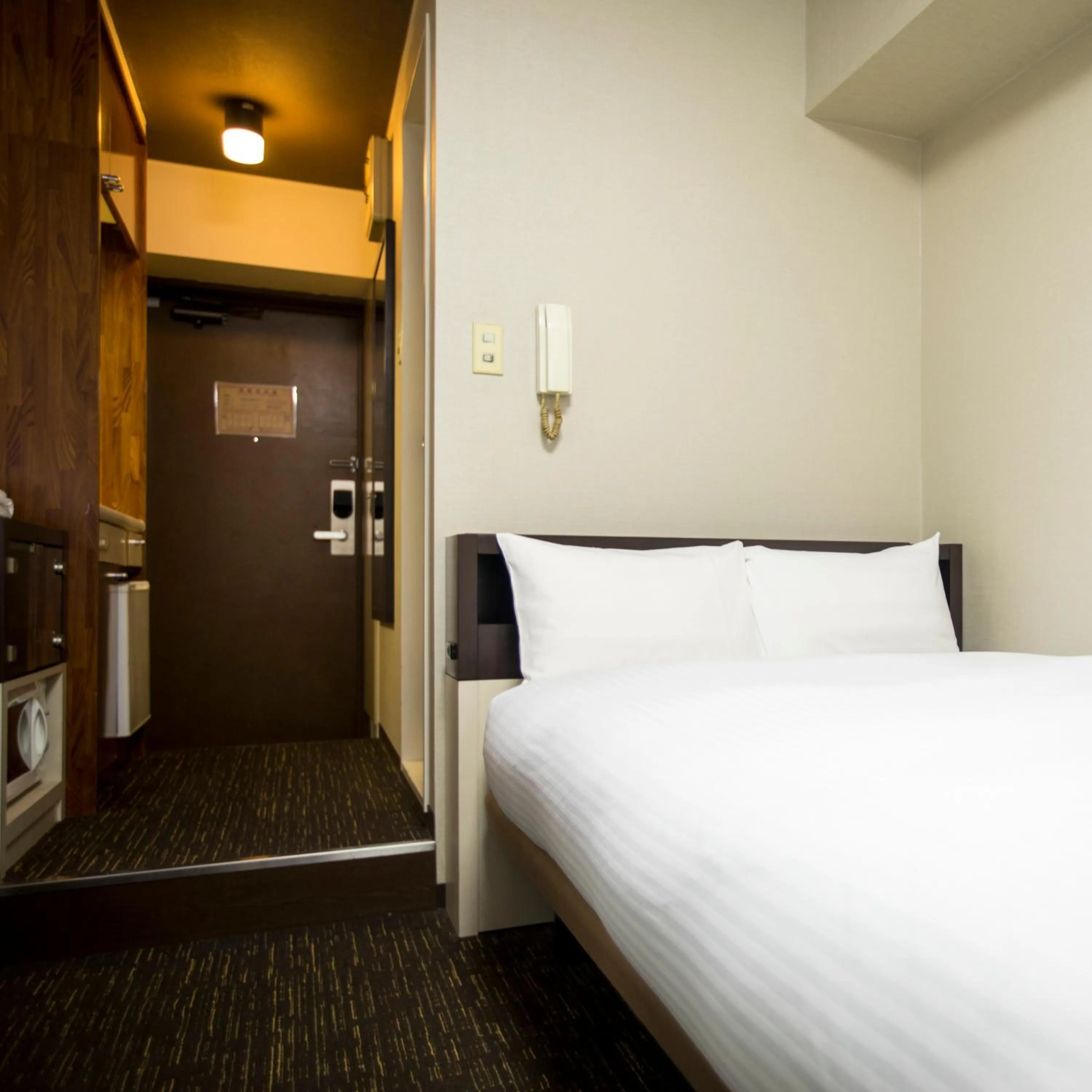 Bed in FLEXSTAY INN Kawasaki Kaizuka