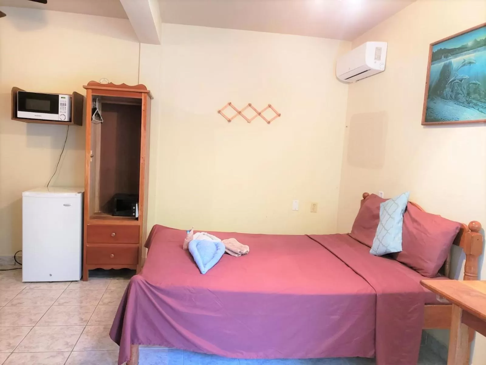 Bed in Beach Side Condos Caye Caulker by CCVH