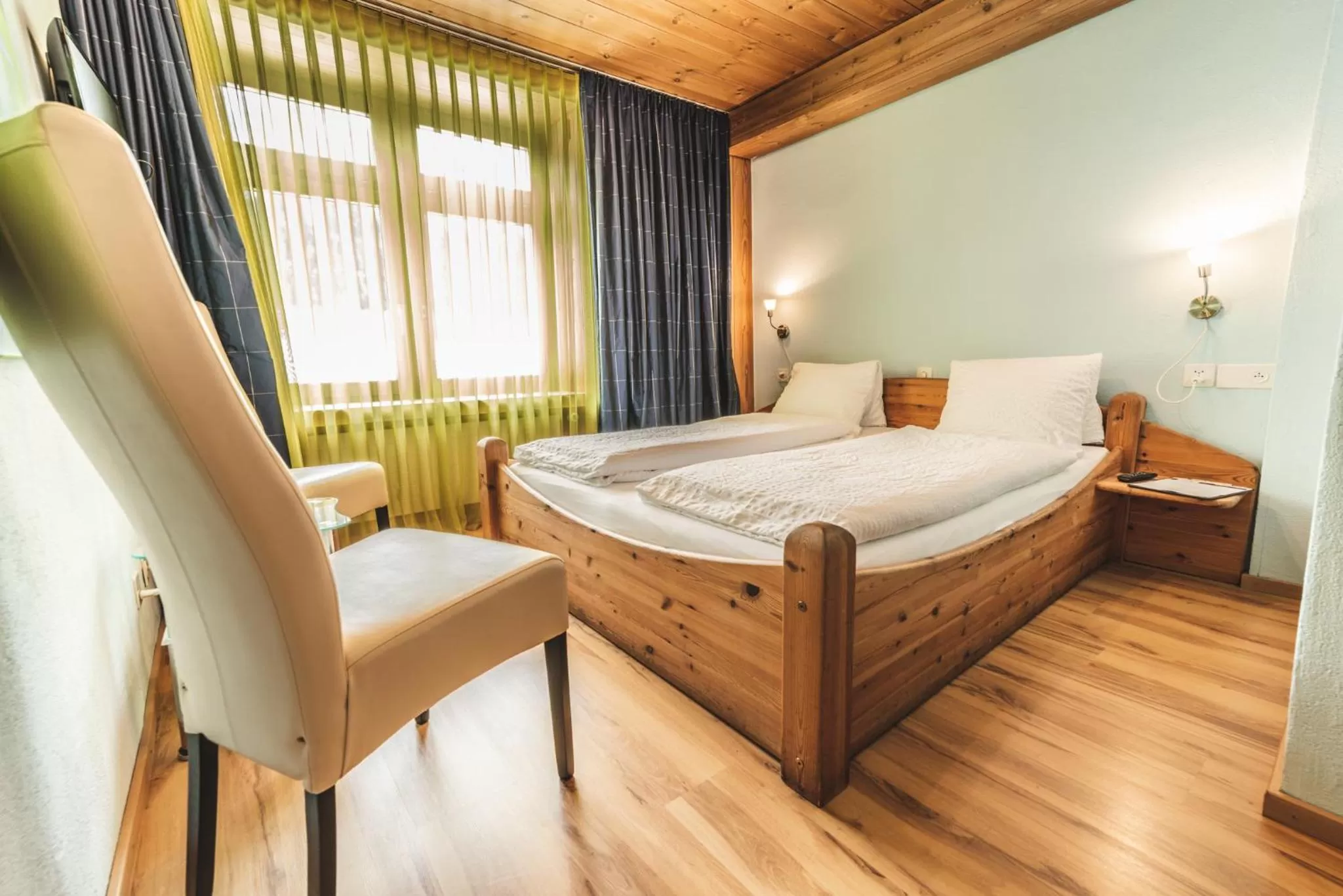 Photo of the whole room, Bed in CURUNA Hotel-Garni