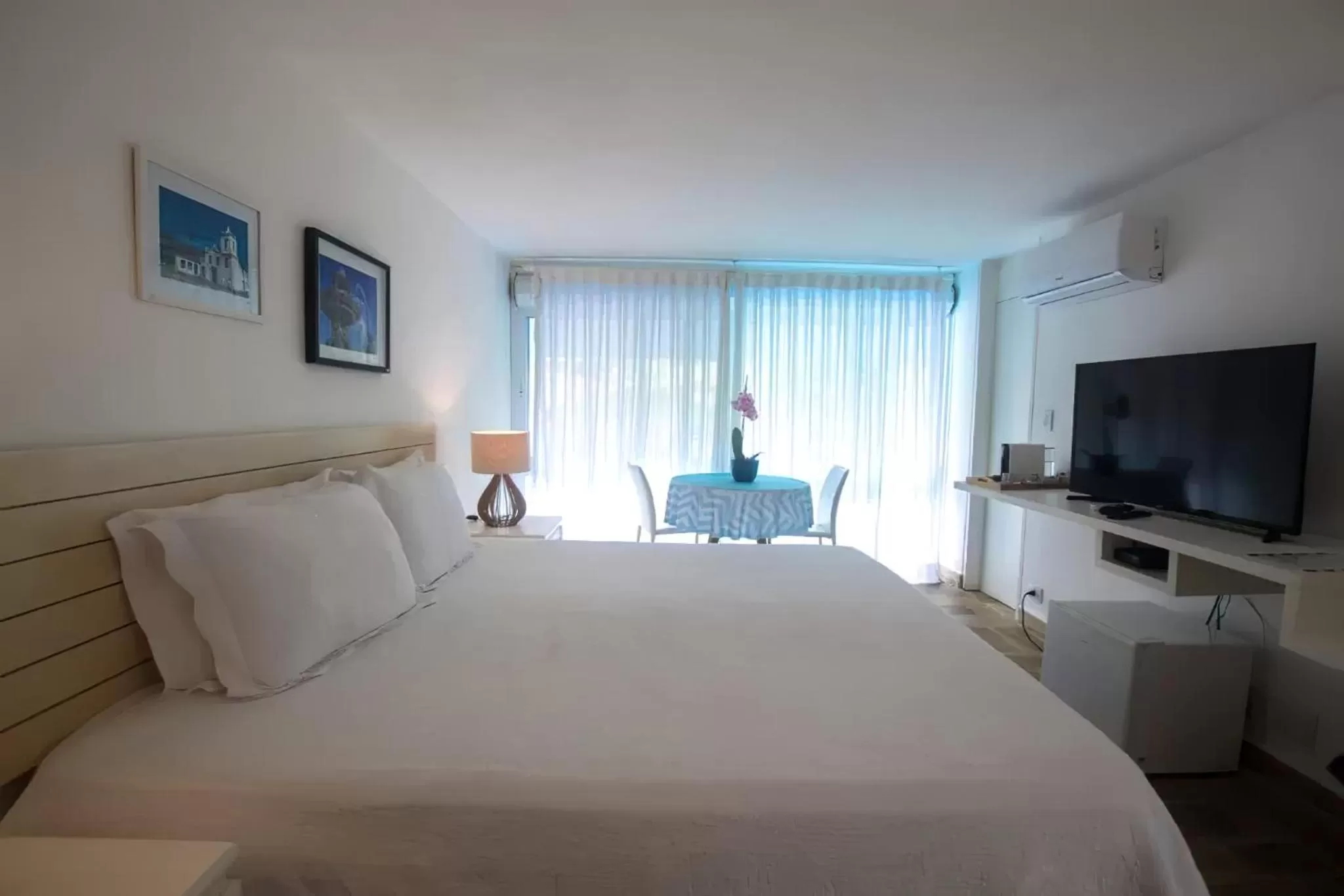 Bed in Guest House Guarujá