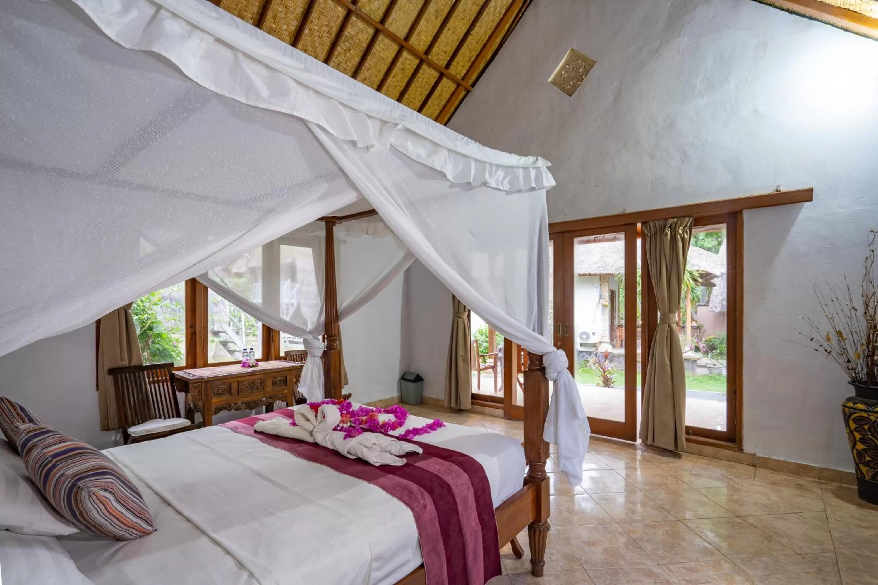 Bed in Mushroom Beach Bungalows