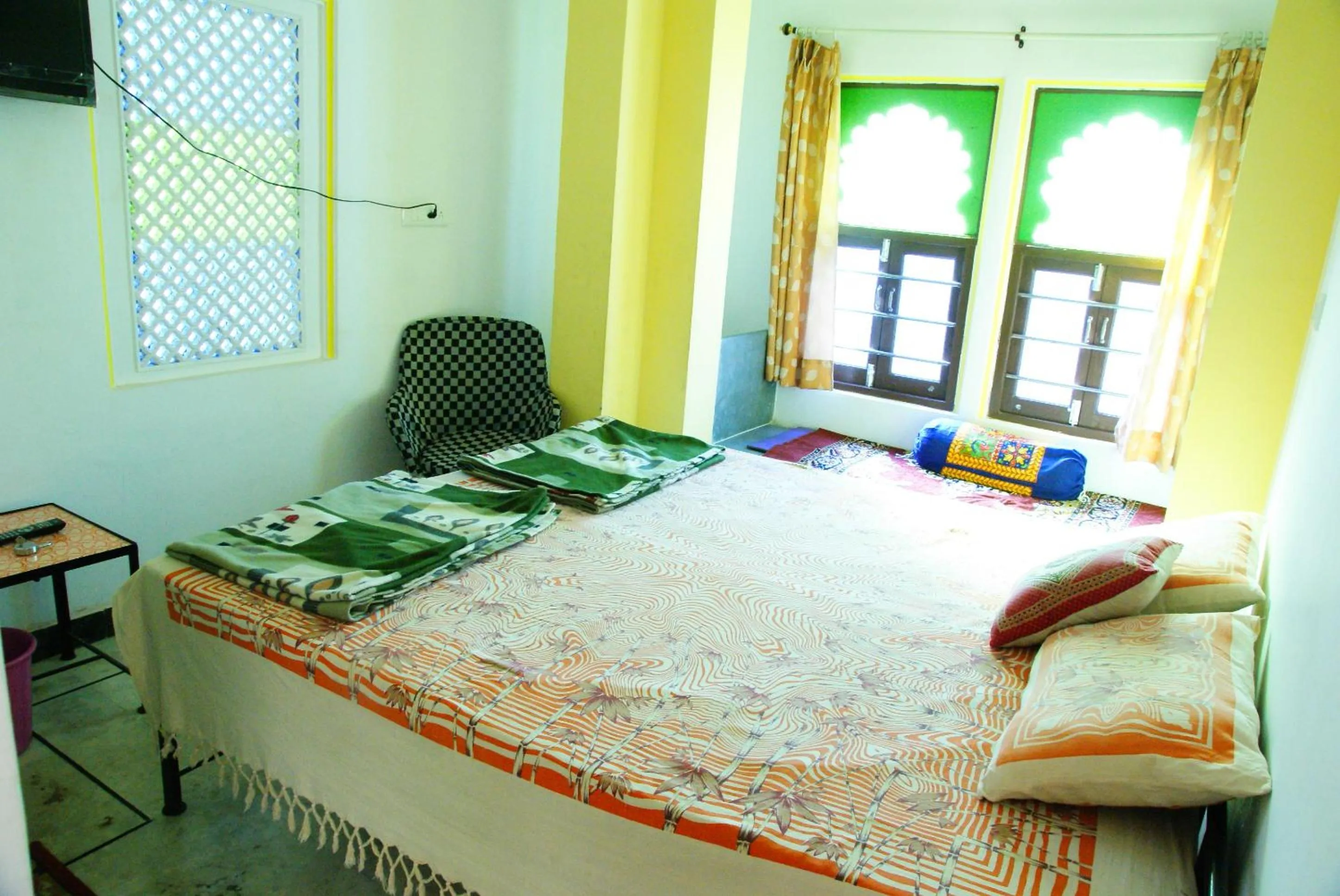 Bed in Udai Haveli Guest House