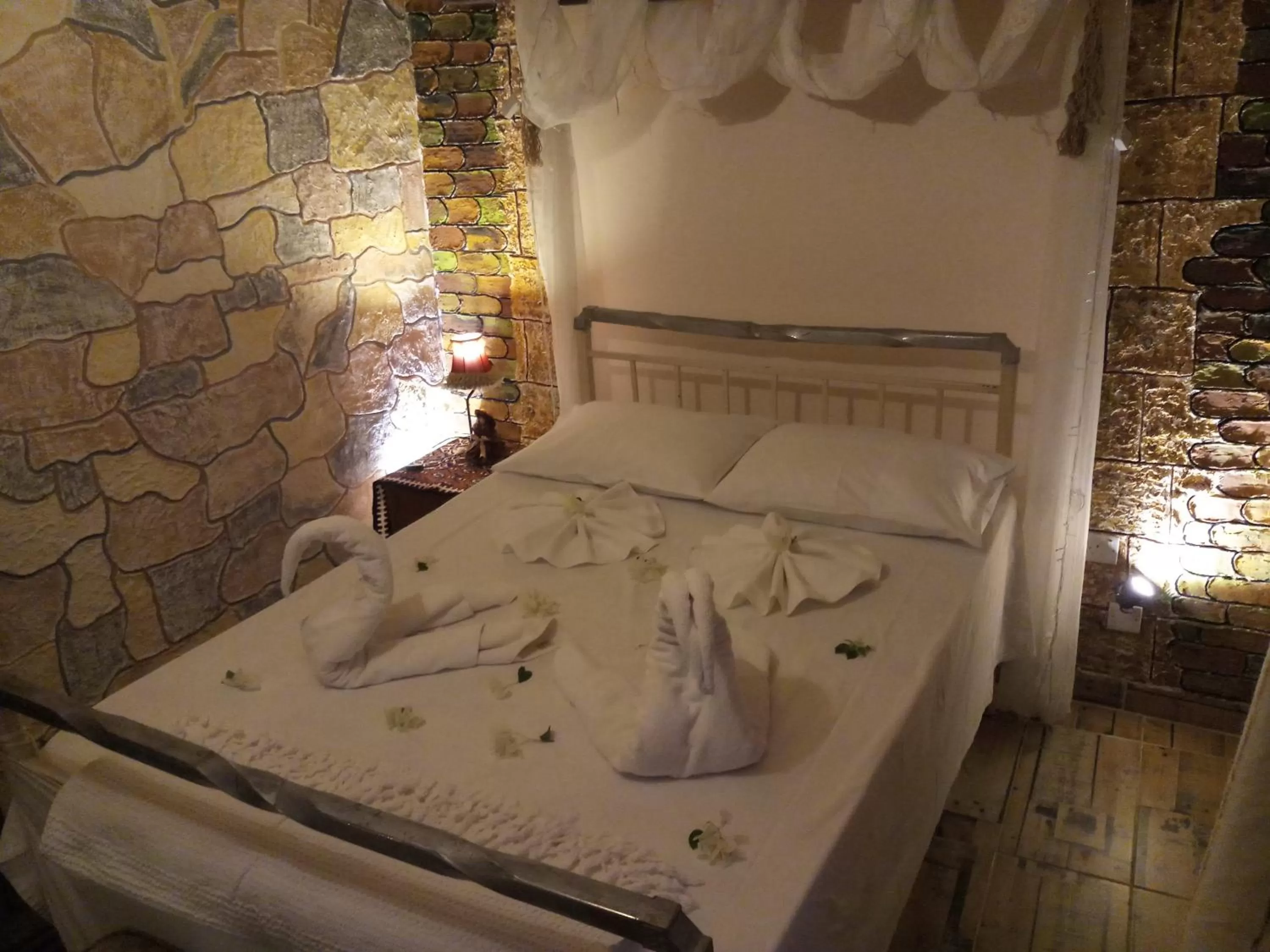 Bed in Mystery Garden Guest House