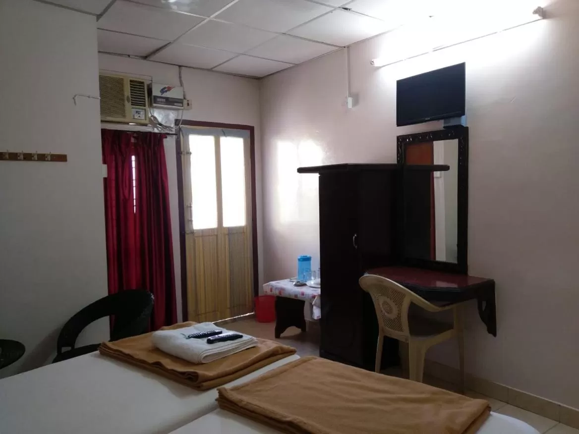 Bed in Anandan Tourist Home