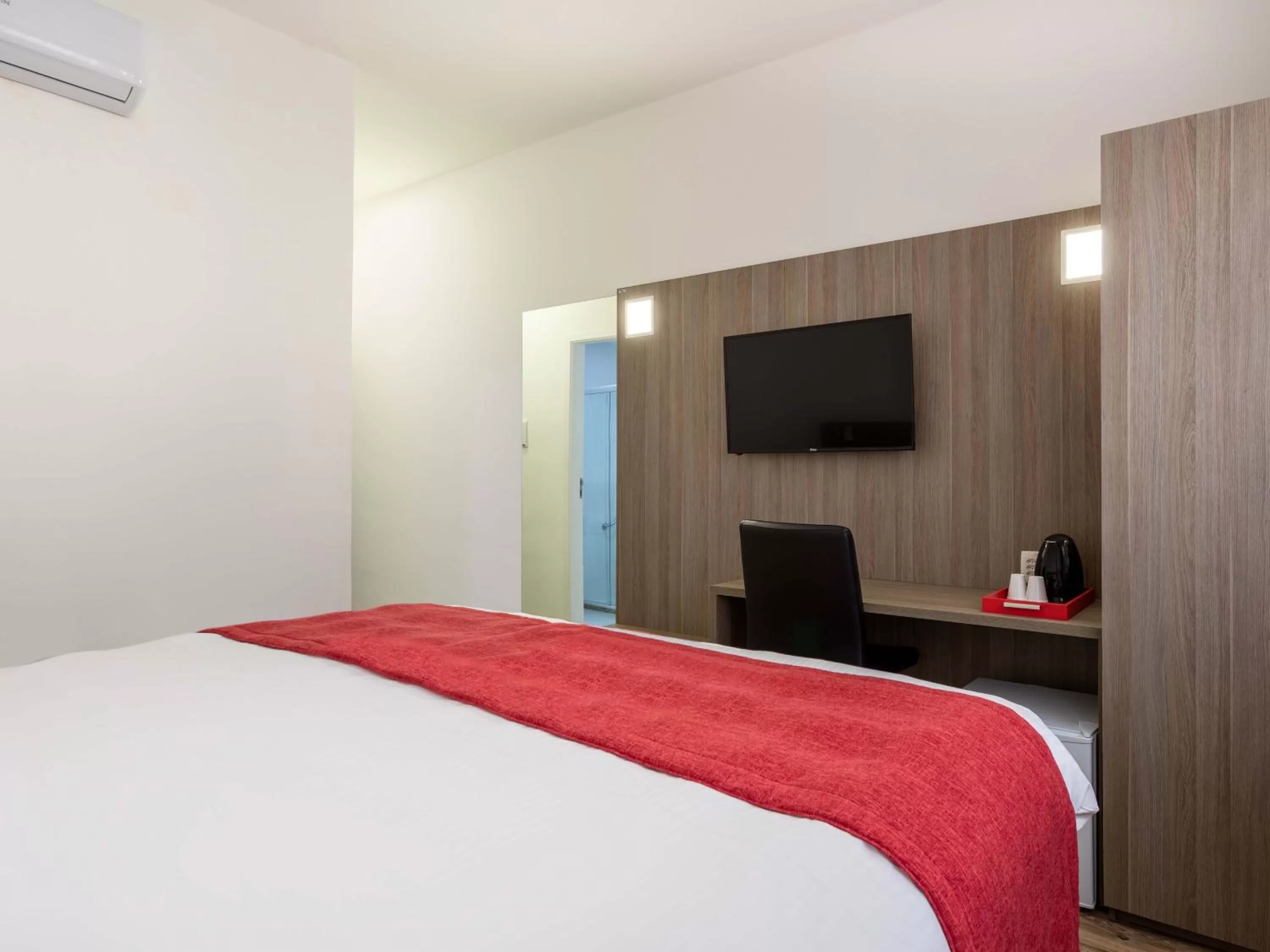 Bed in Ramada Encore by Wyndham São Paulo Osasco