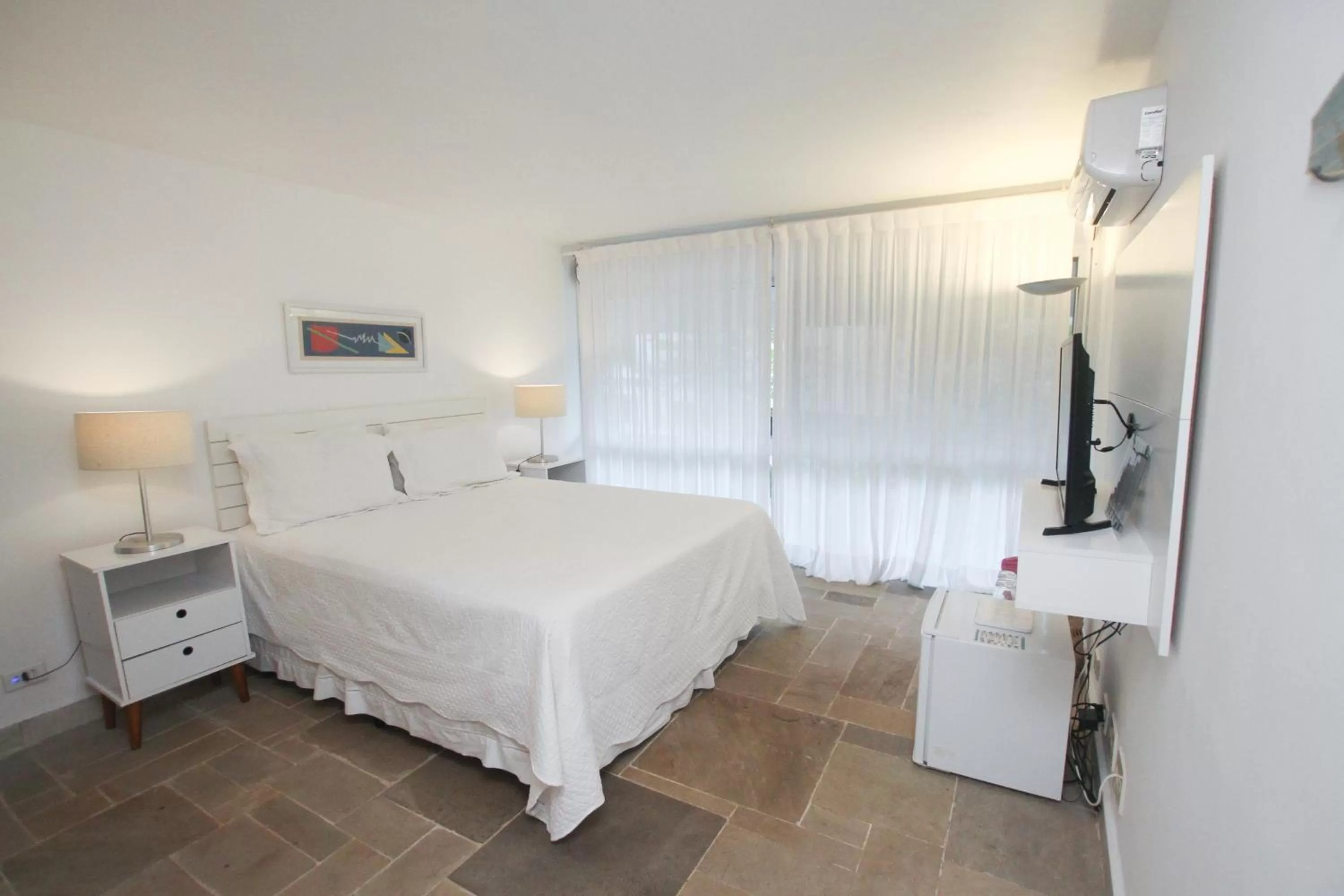 Bed in Guest House Guarujá