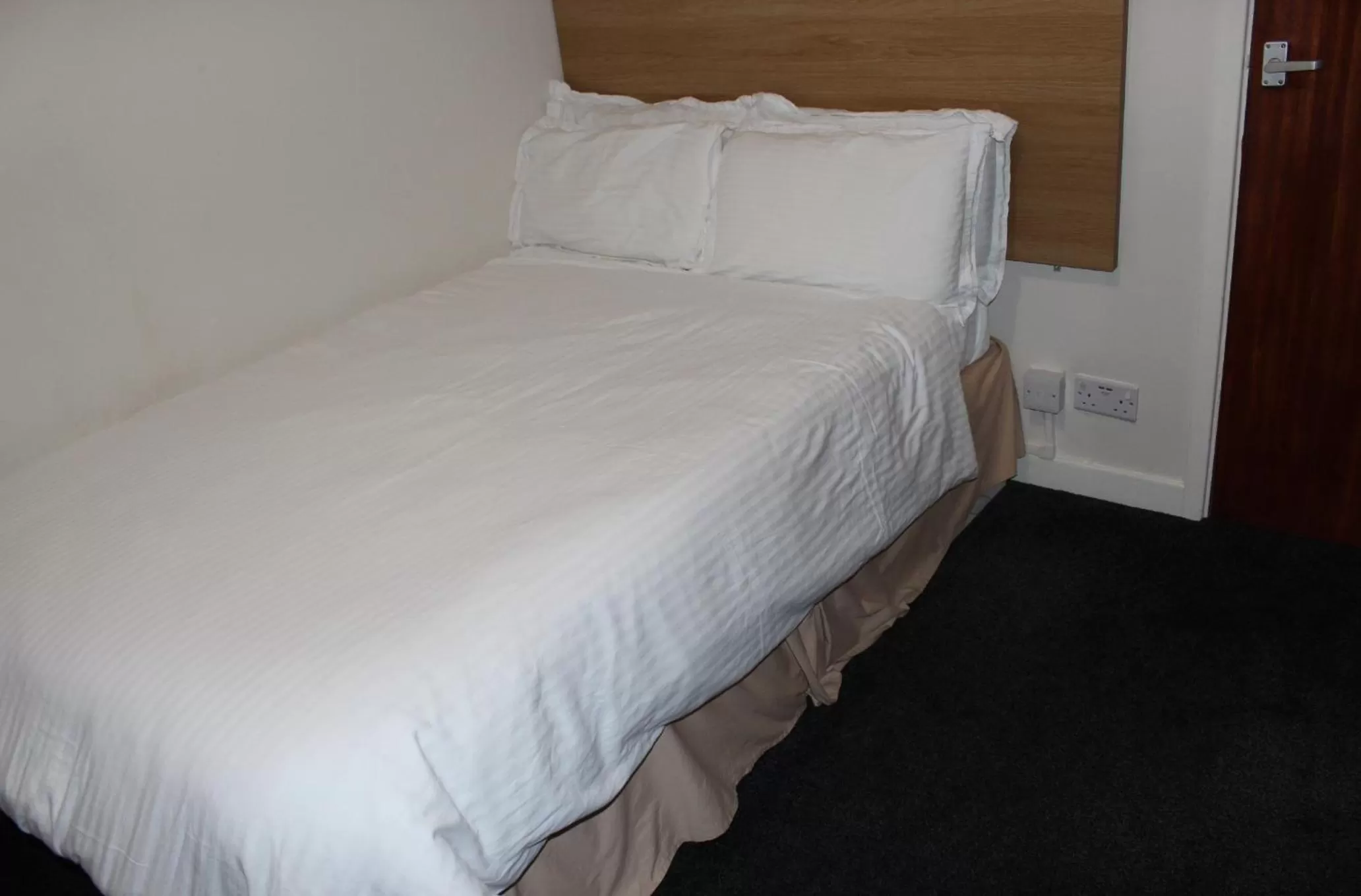 Bed in The Premier Lodge