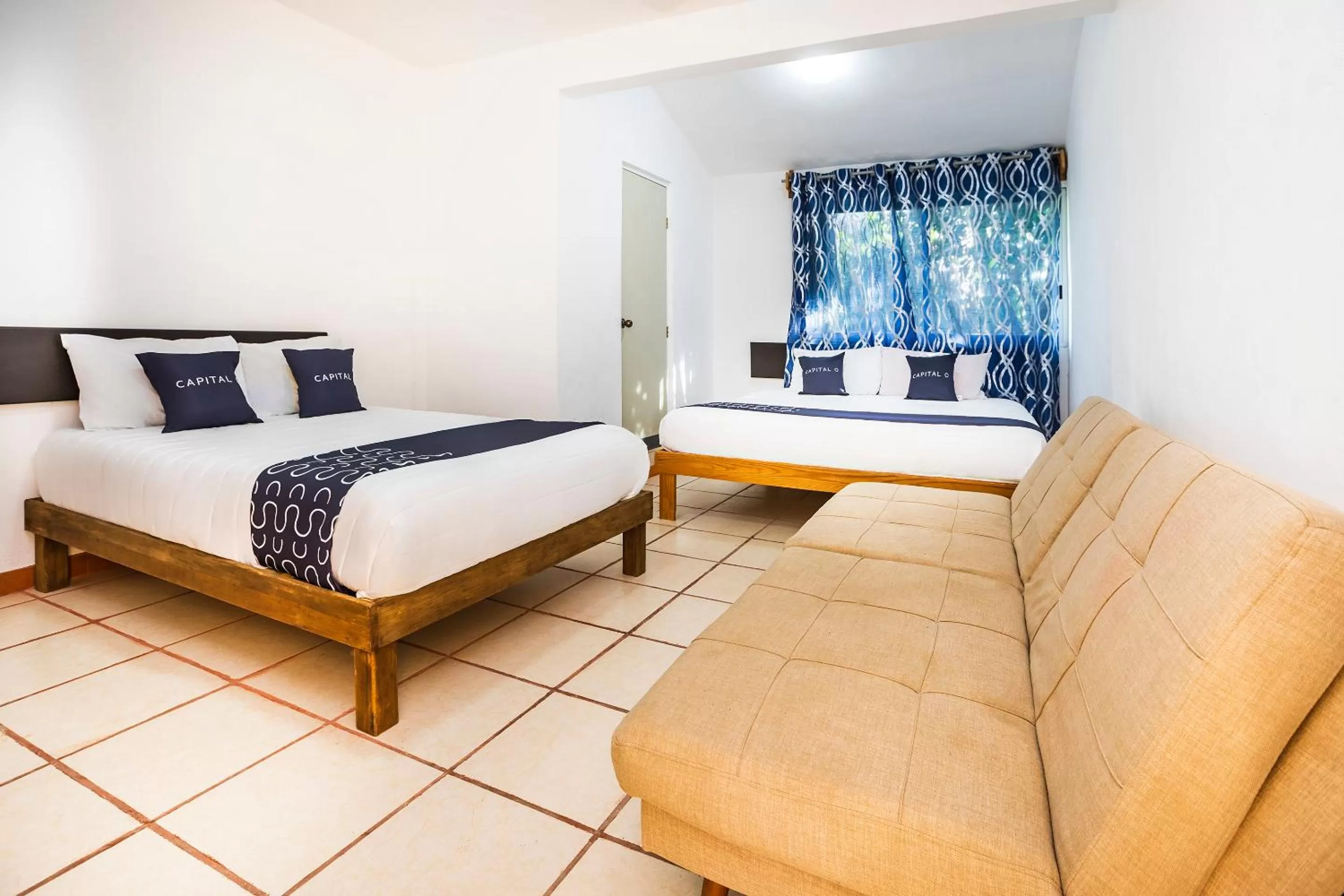 Living room, Bed in Capital O Oxtankah,chetumal bay