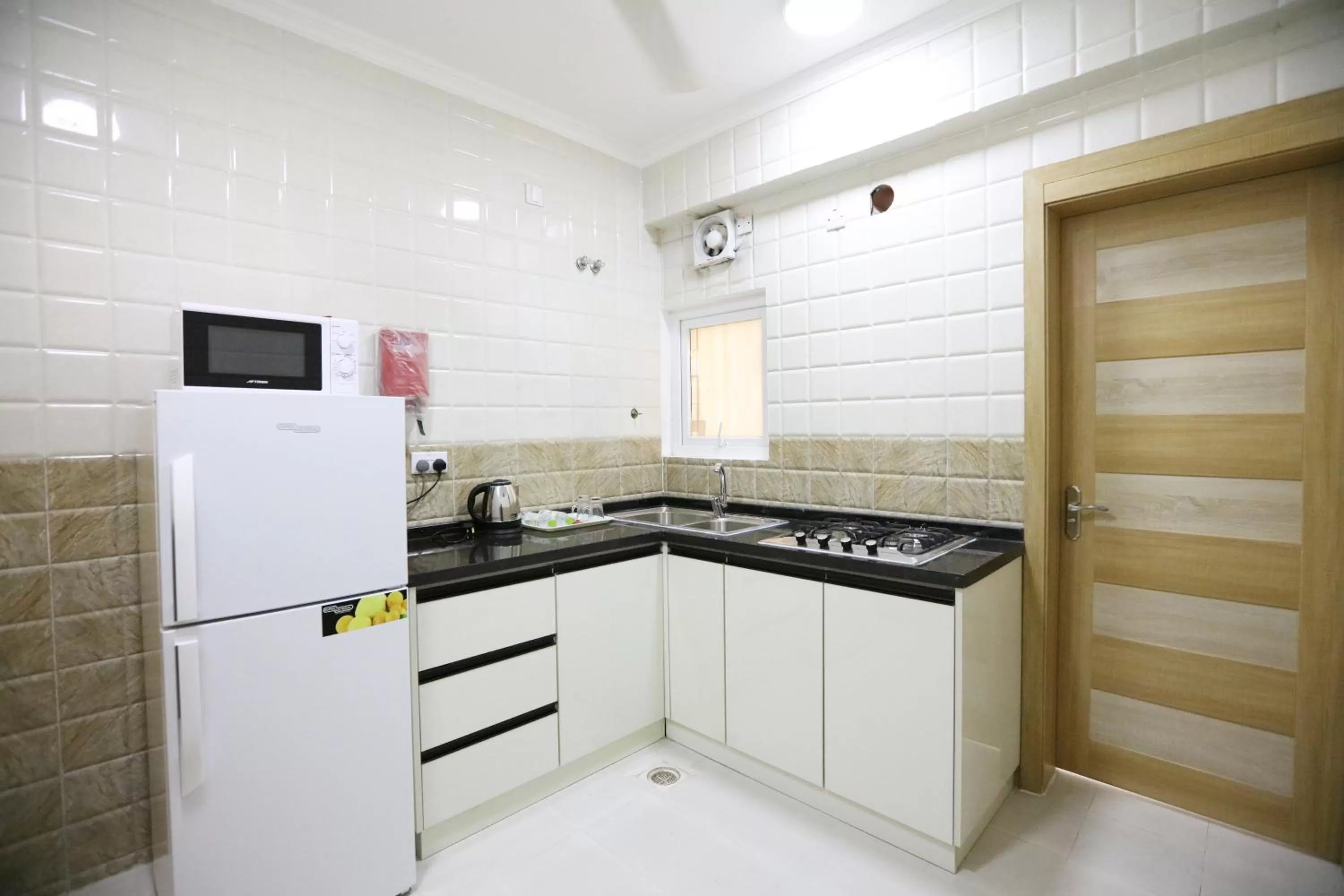 Kitchen or kitchenette in Al Rayyan Hotel Apartments Muscat
