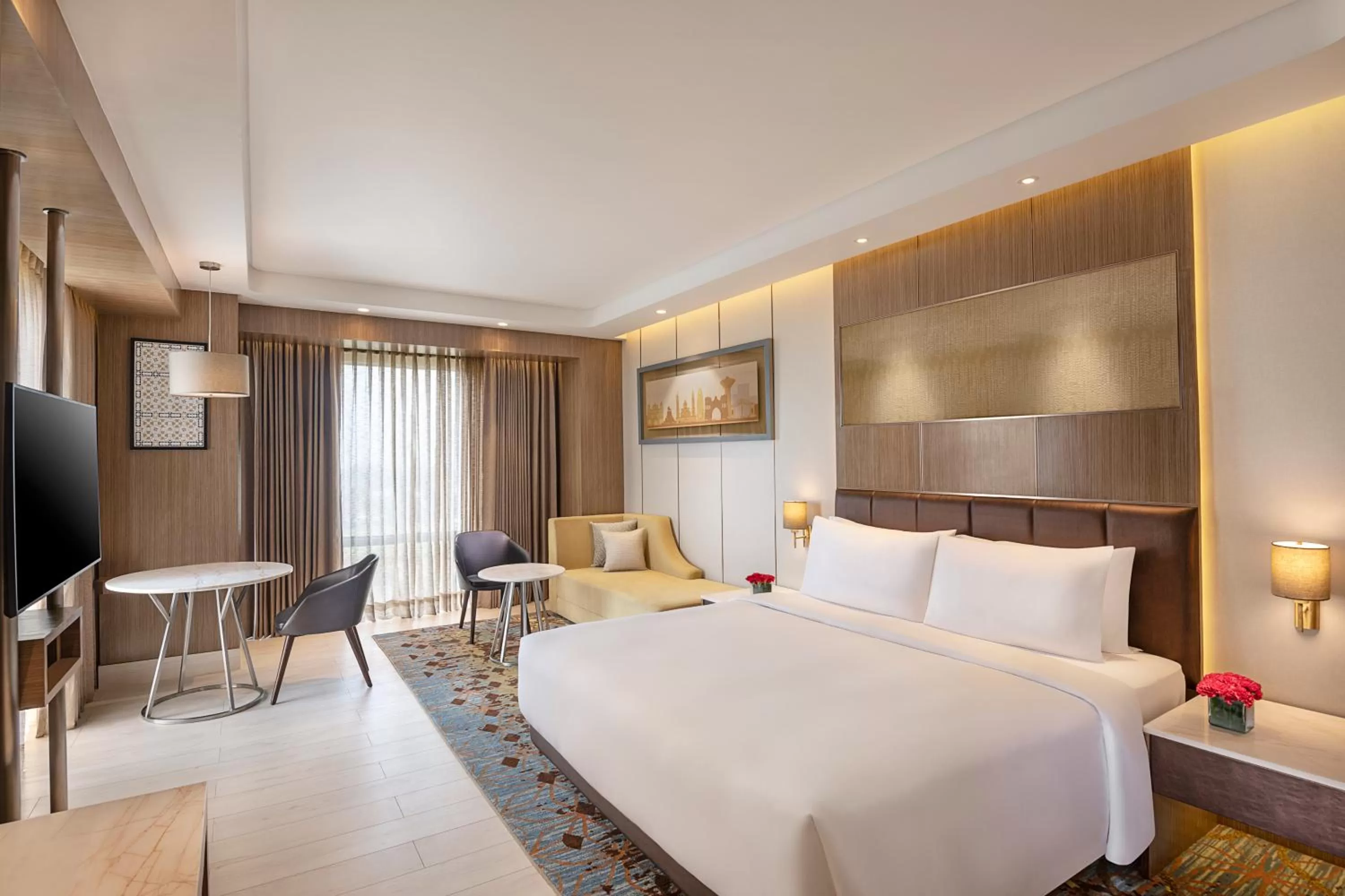 Communal lounge/ TV room, Bed in Radisson Blu Hotel Amritsar