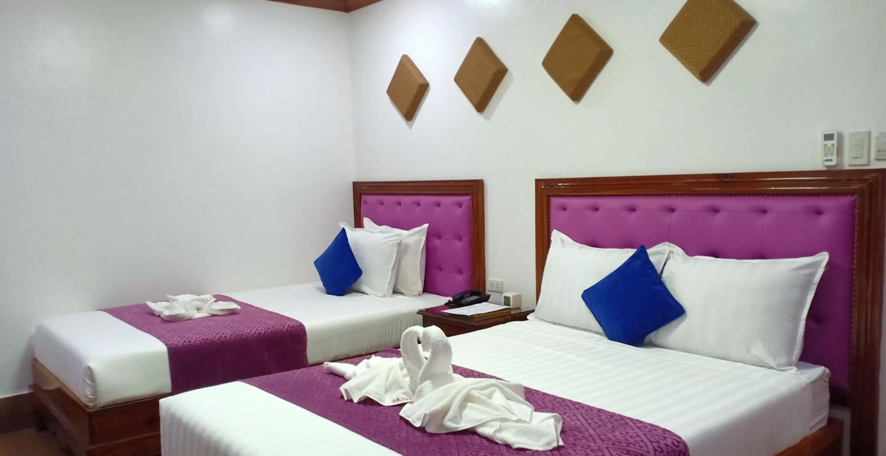 Bed in CLN Boutique Hotel