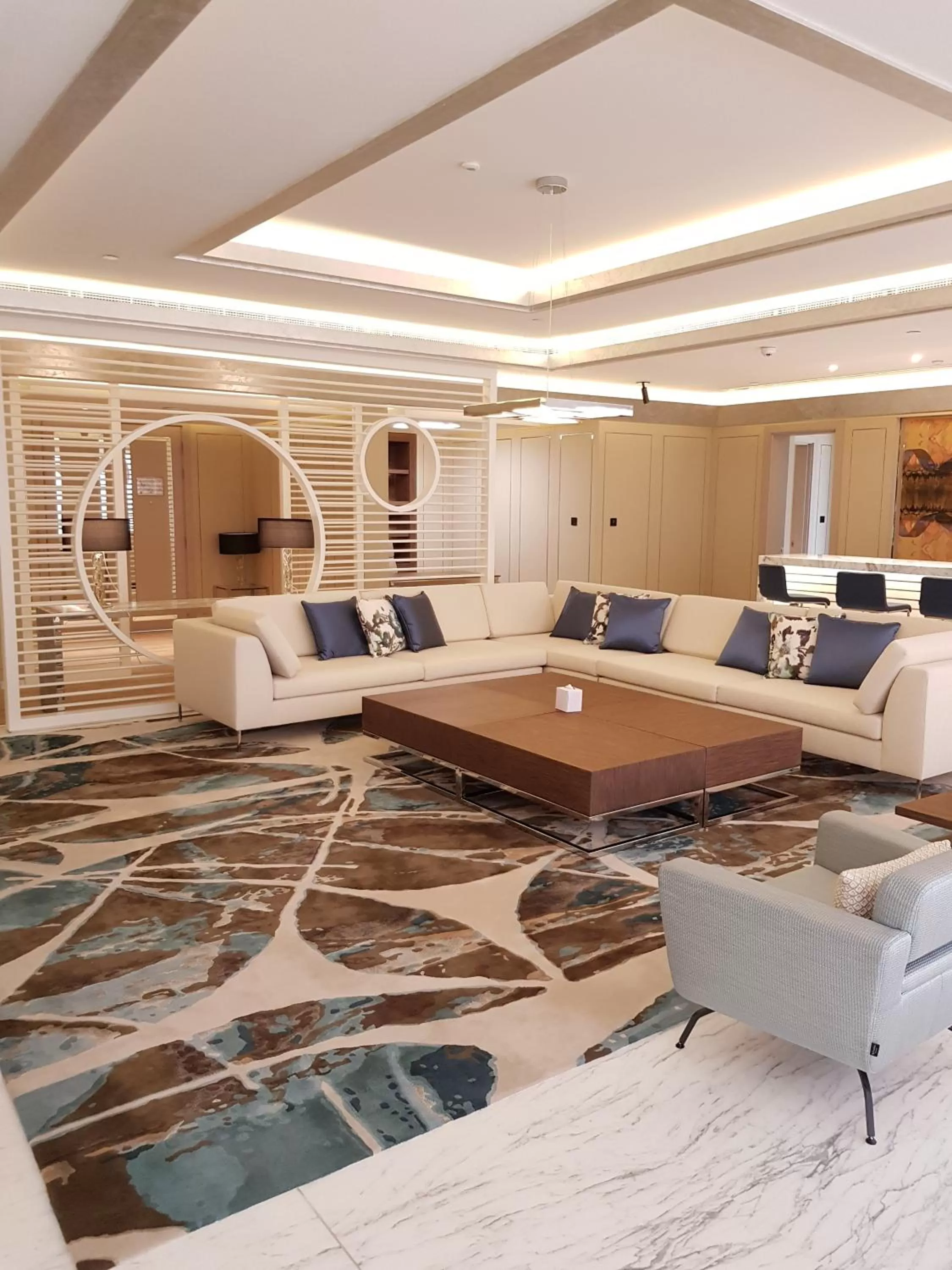 Communal lounge/ TV room in Royal M Hotel Abu Dhabi by Gewan