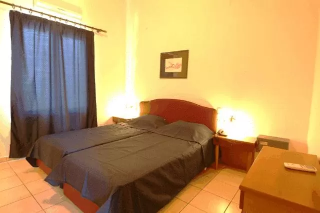 Bed in Polydoros Appartments