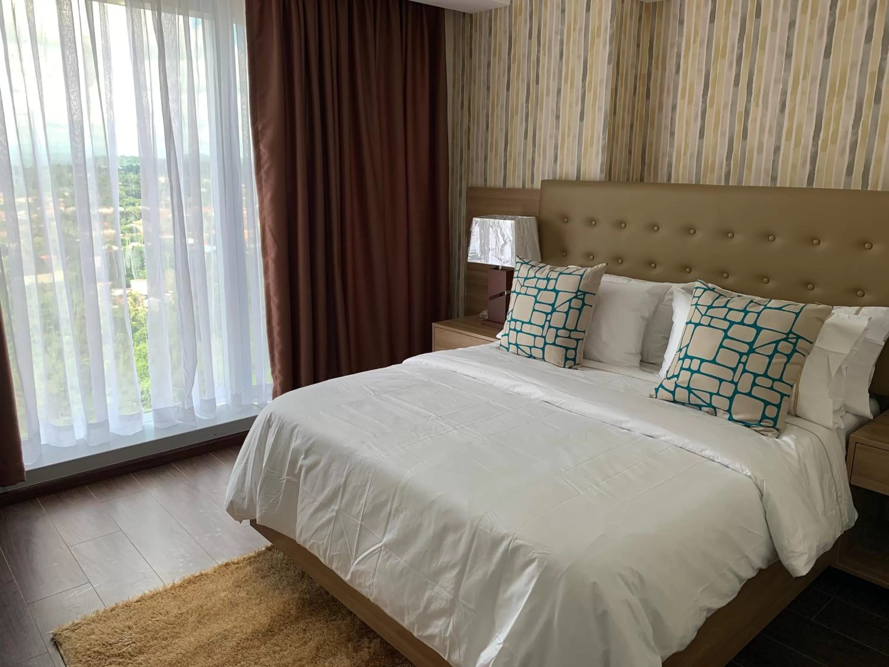 Bedroom, Bed in AEON SUITES Staycation