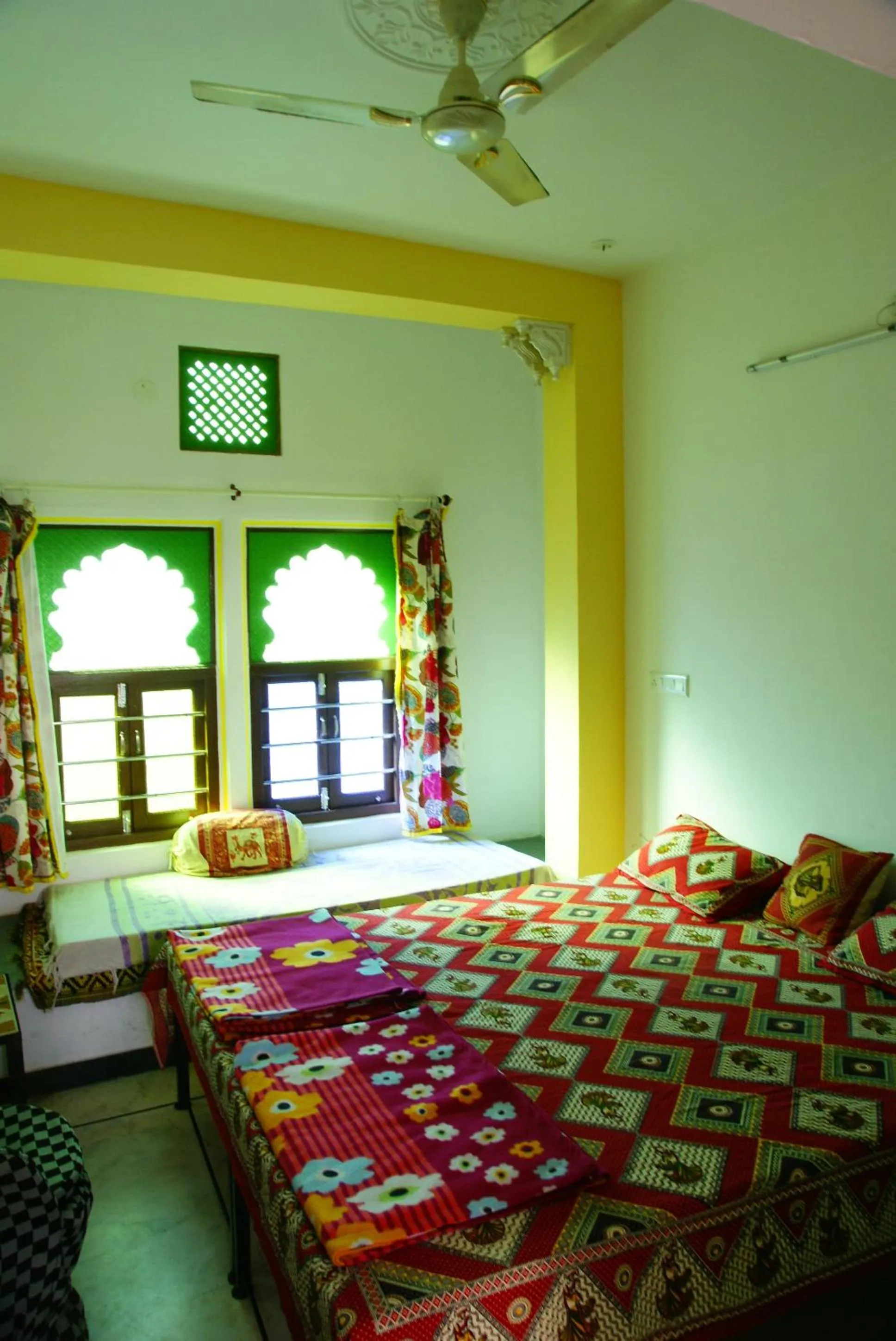Bed in Udai Haveli Guest House
