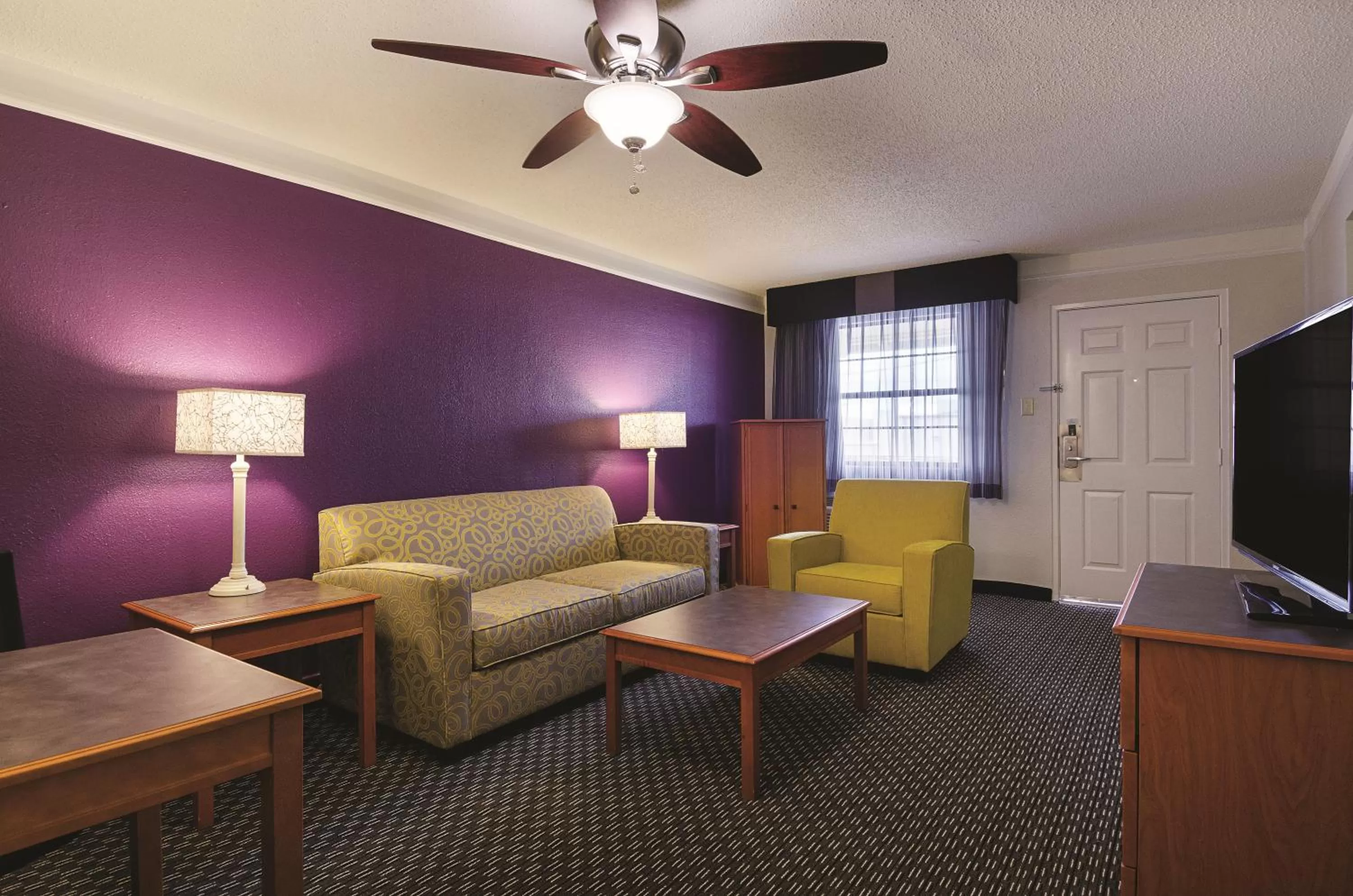 Living room in Baymont by Wyndham Greenville Woodruff Rd