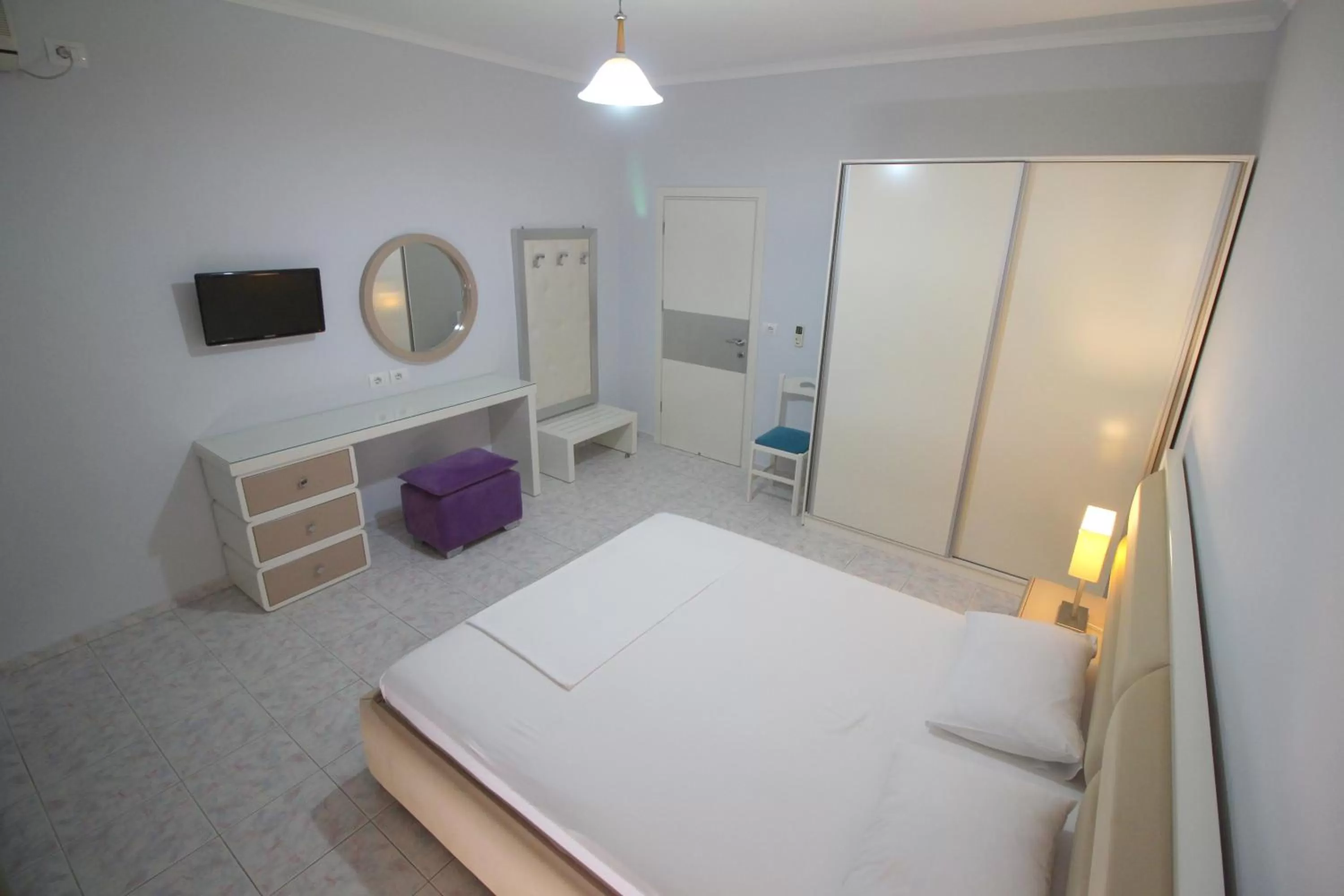 Bed in Murati Suites Sarandë