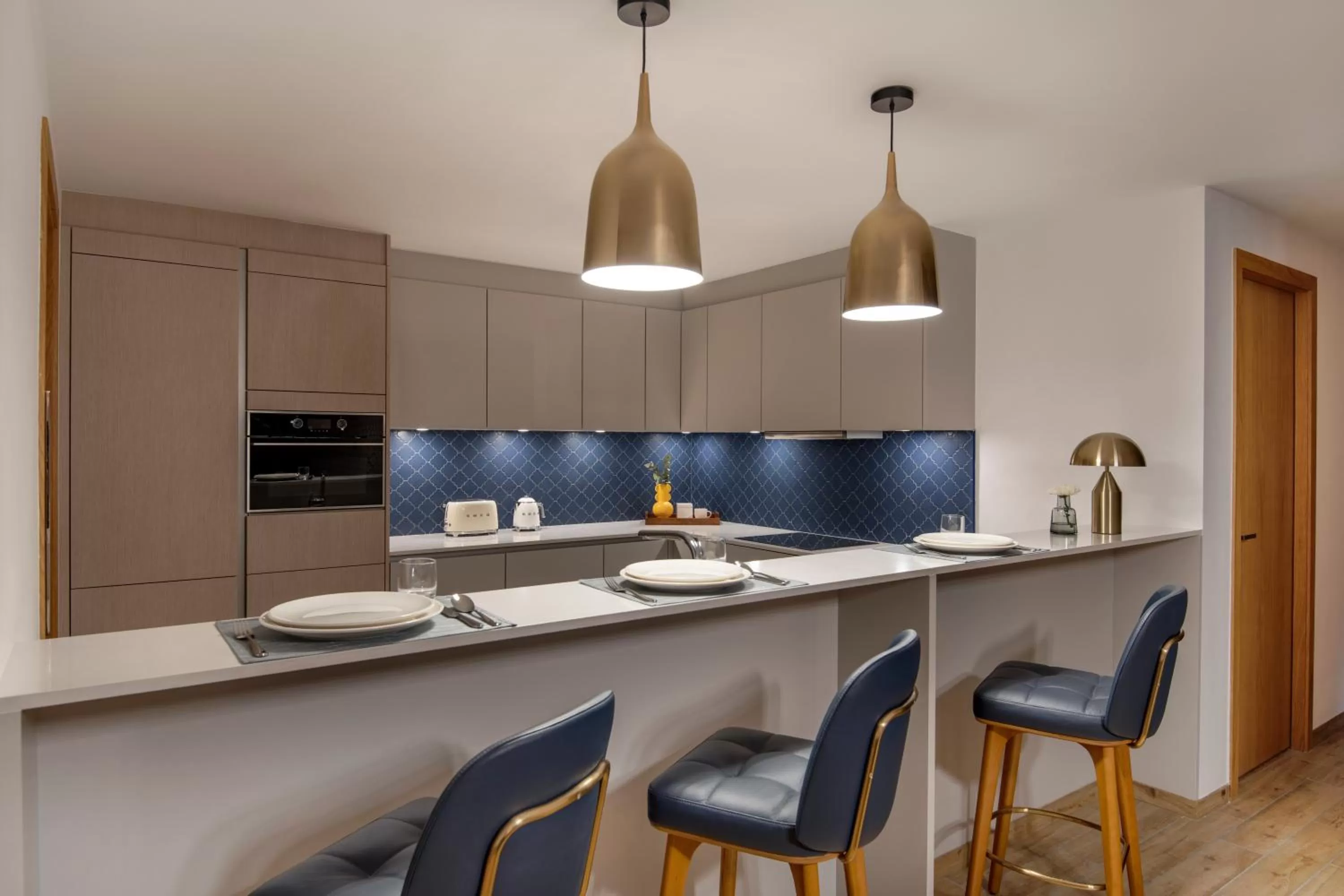 Kitchen or kitchenette in Abesq Doha Hotel and Residences, an IHG Hotel