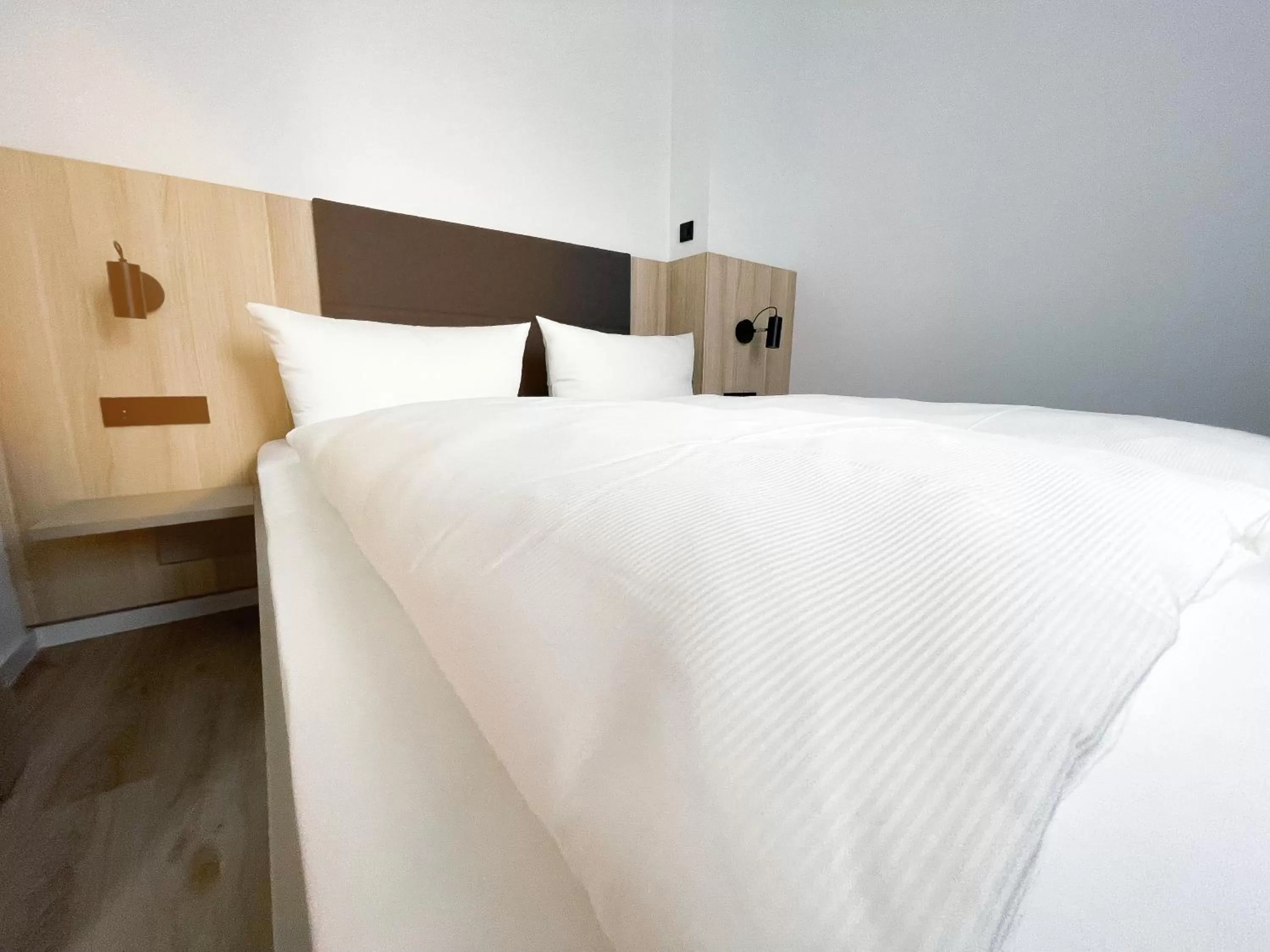 Bed in HOLI City Apart Hotel Berlin