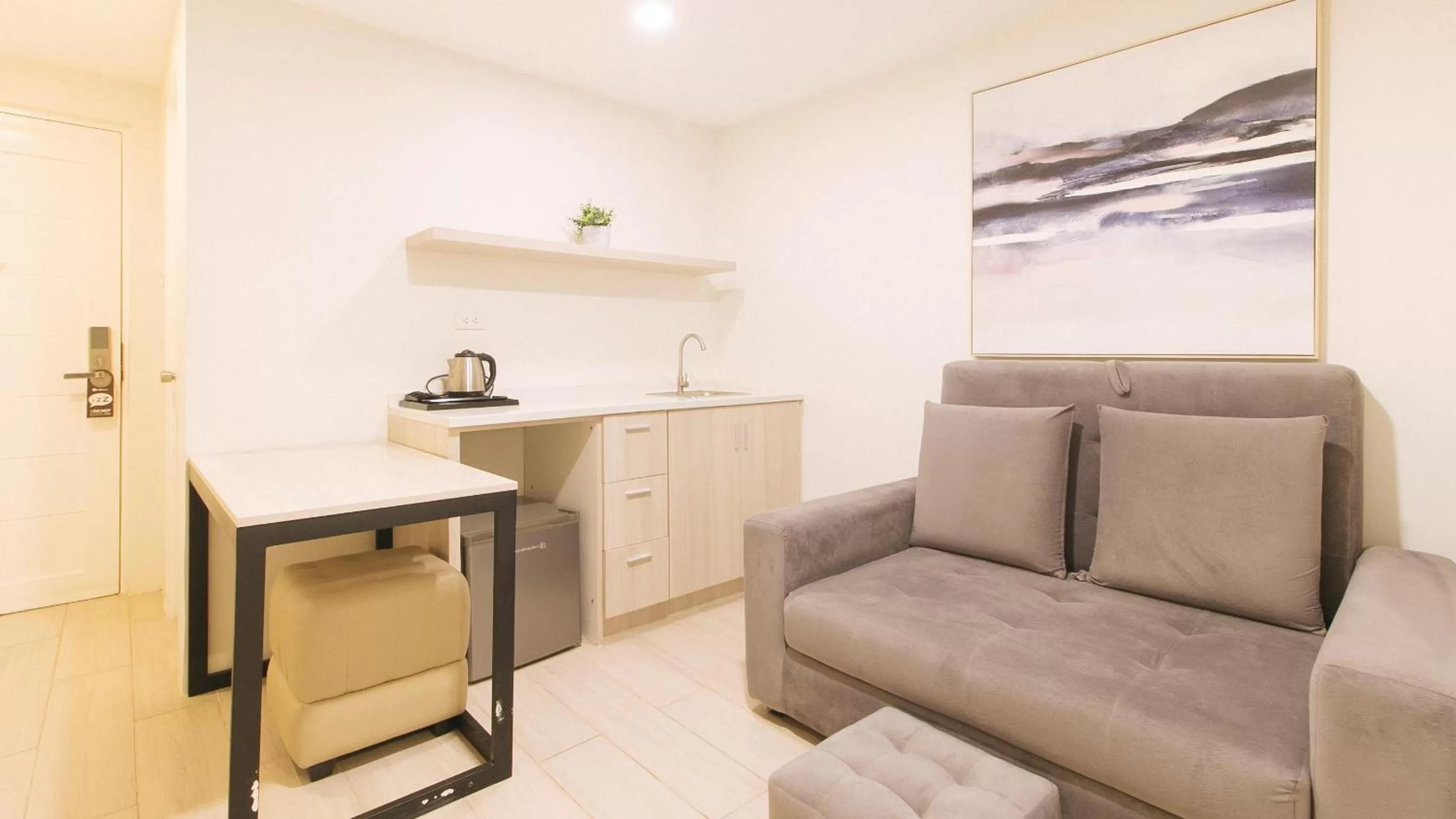 Seating area in RedDoorz Plus at La Belle Residences Makati City