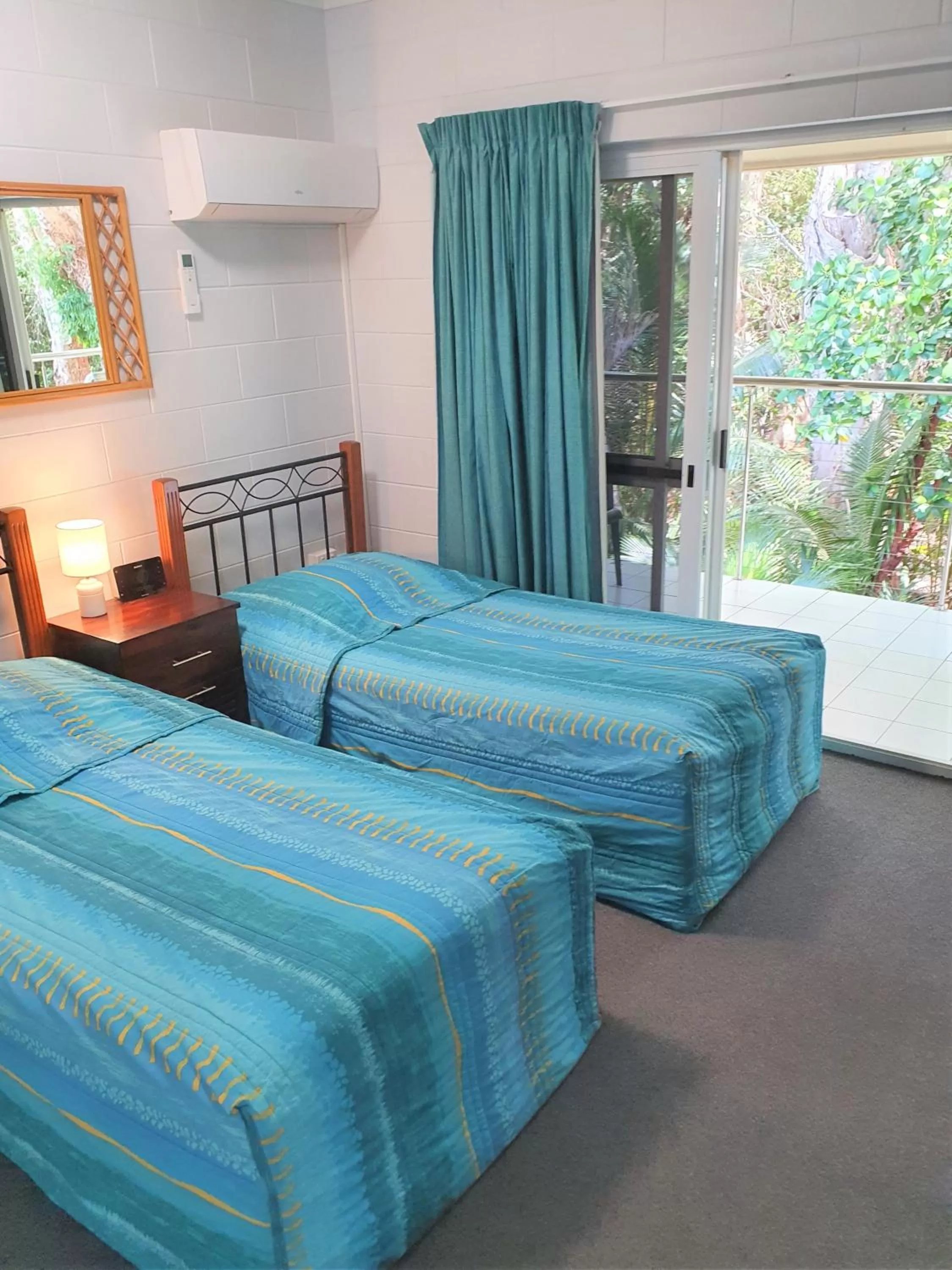 Bed in Mango Tree Holiday Apartments