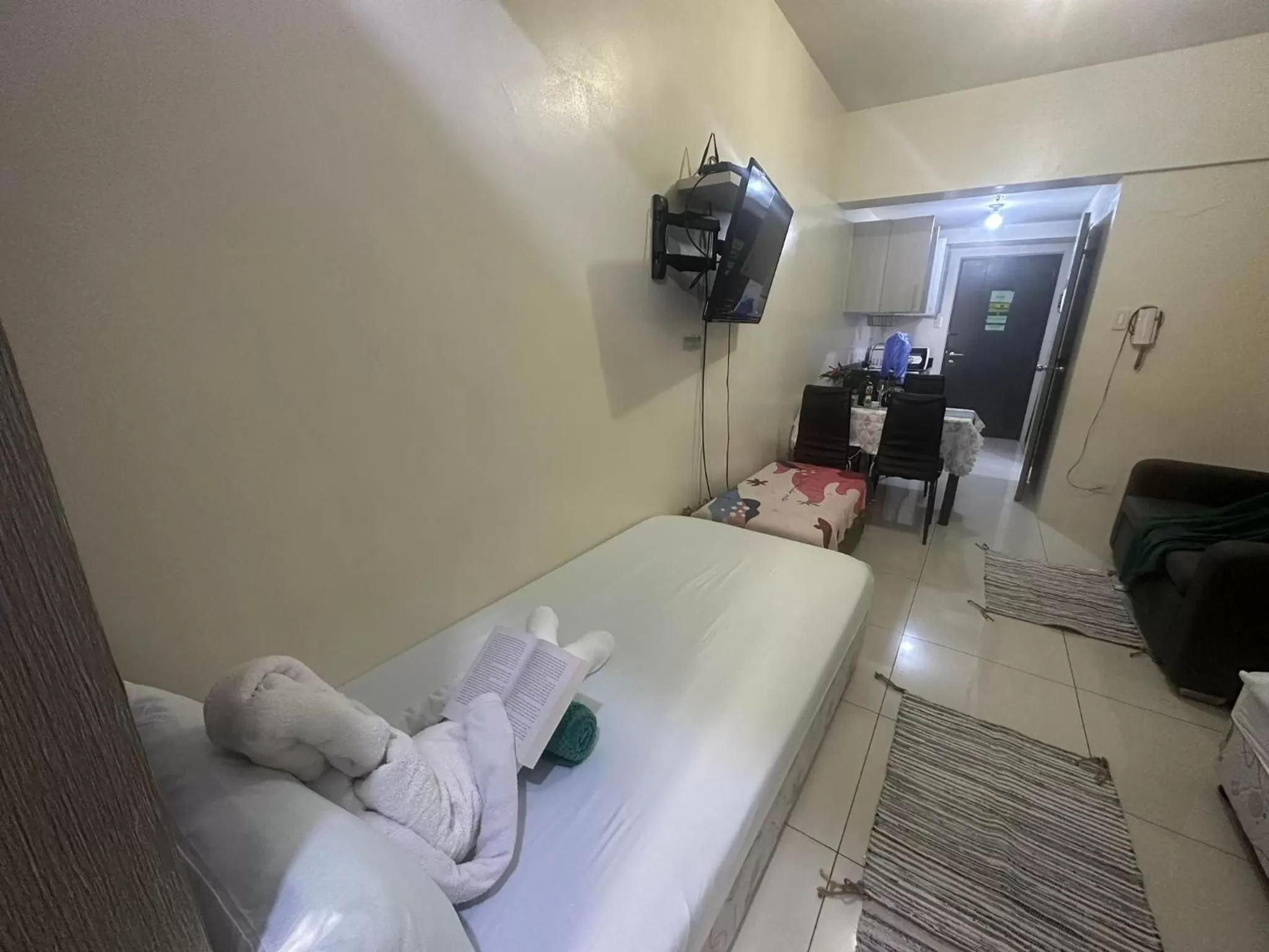 Bed in Green Residences Stays by PBYY