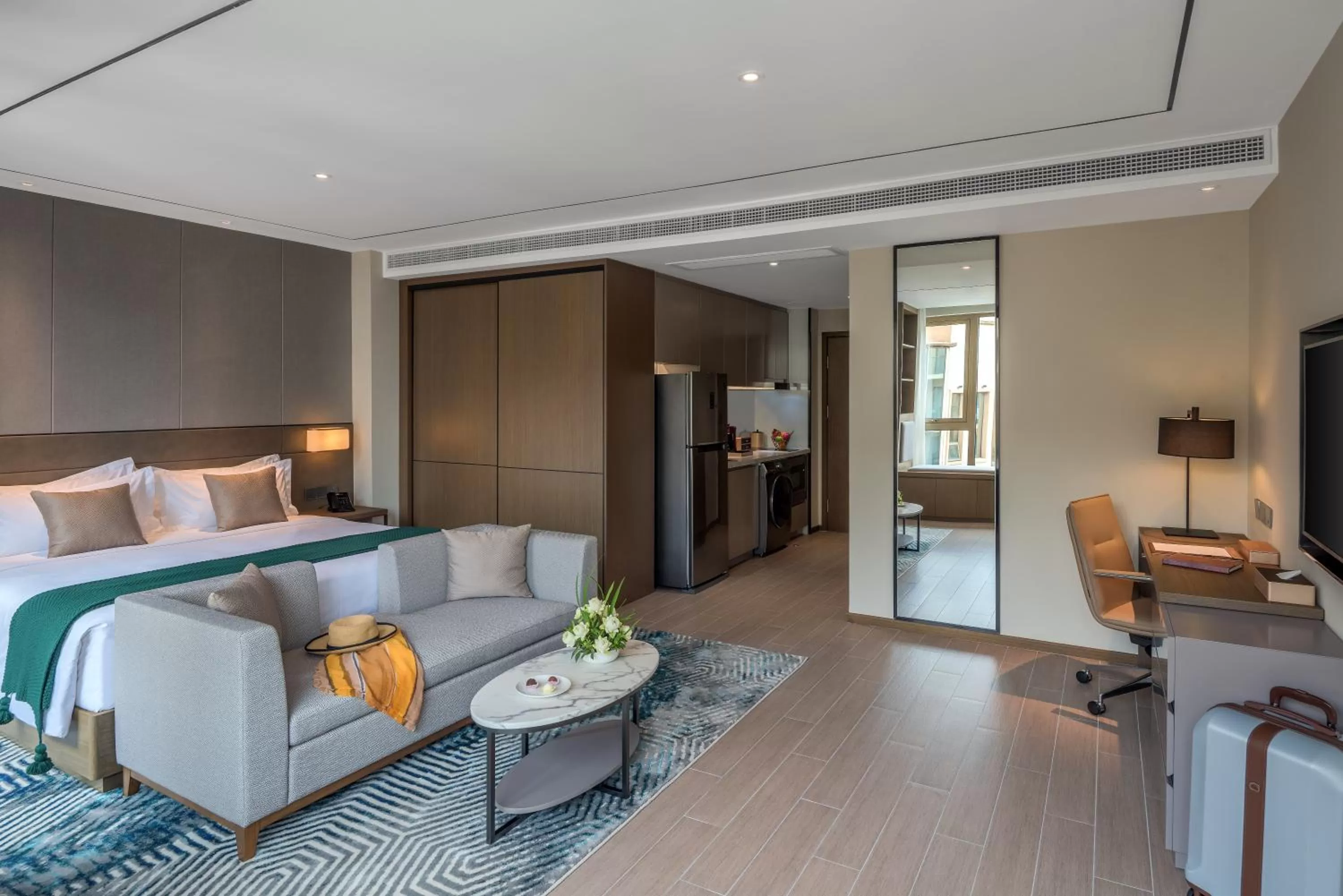 Communal lounge/ TV room, Bed in Oakwood Premier Phnom Penh