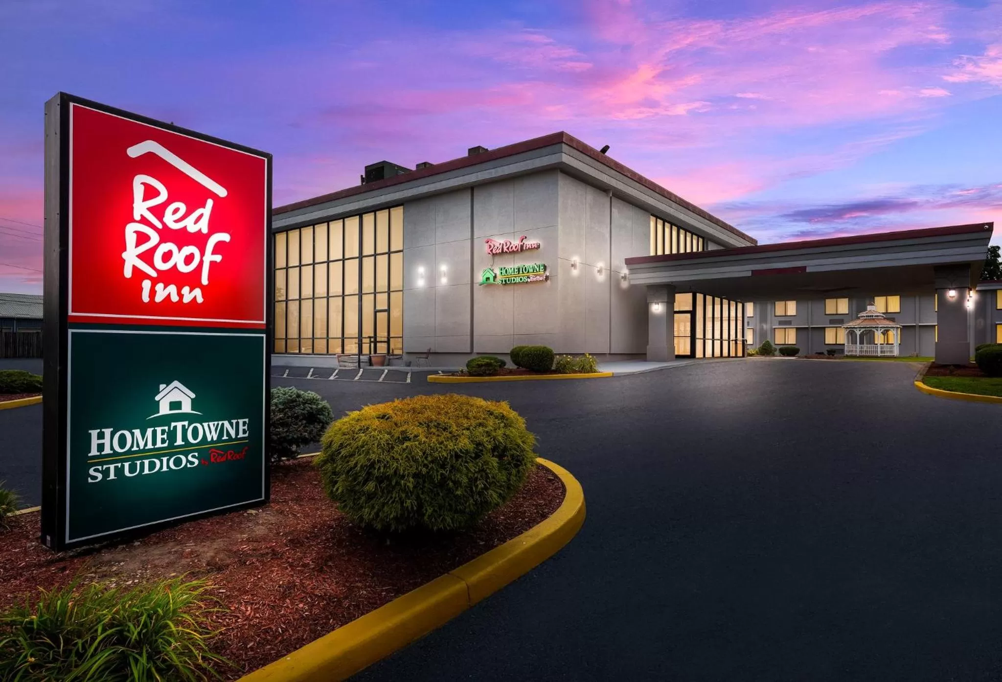 Property building in HomeTowne Studios by Red Roof Painted Post