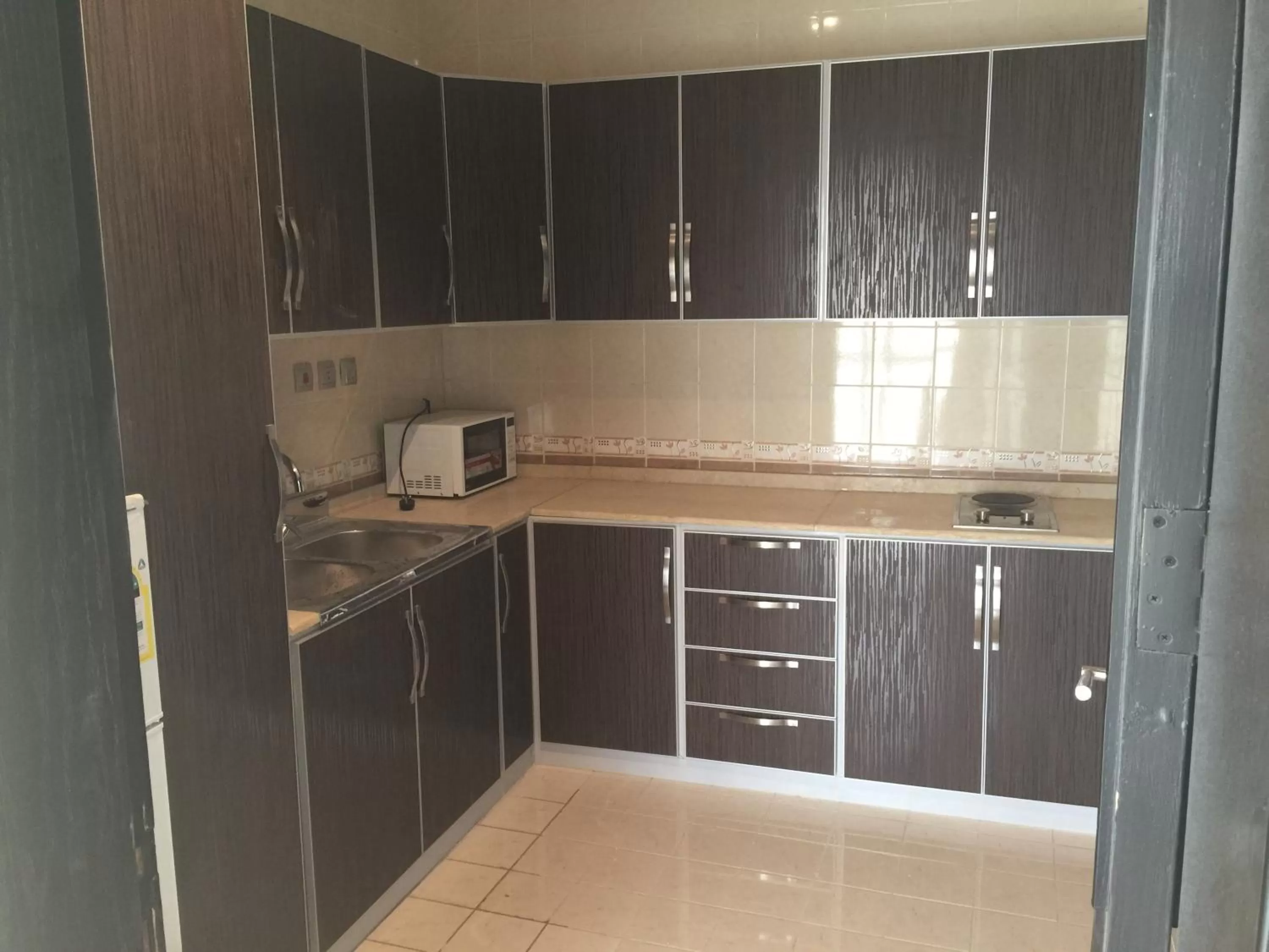 Kitchen/Kitchenette in Alshaheen Suites