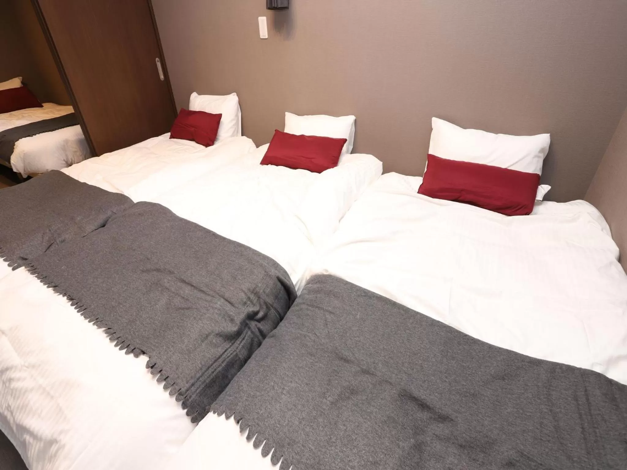 Bed in UCHI Living Stay Sapporo Kikusui