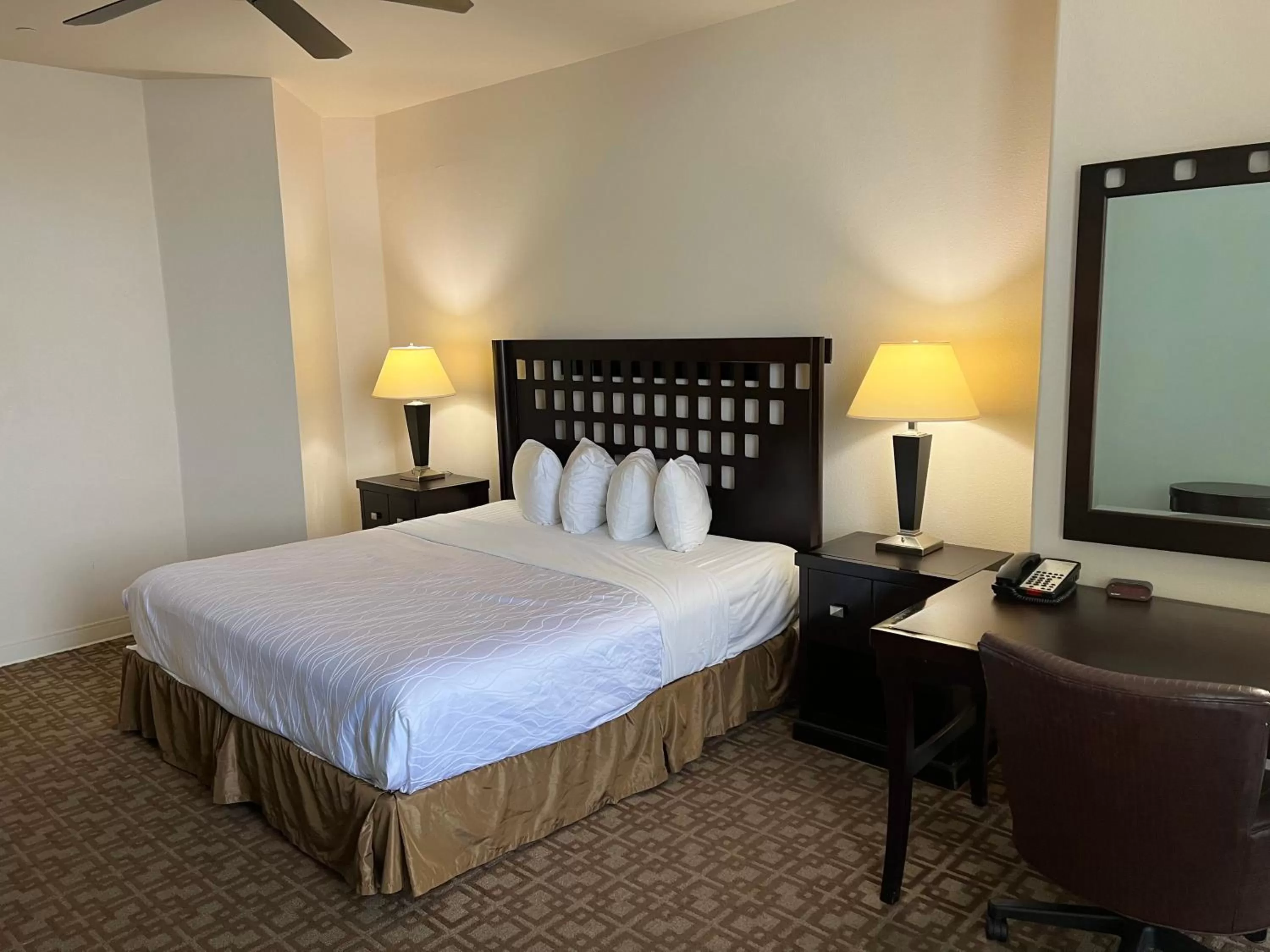 Bed in Sunchase Inn & Suites