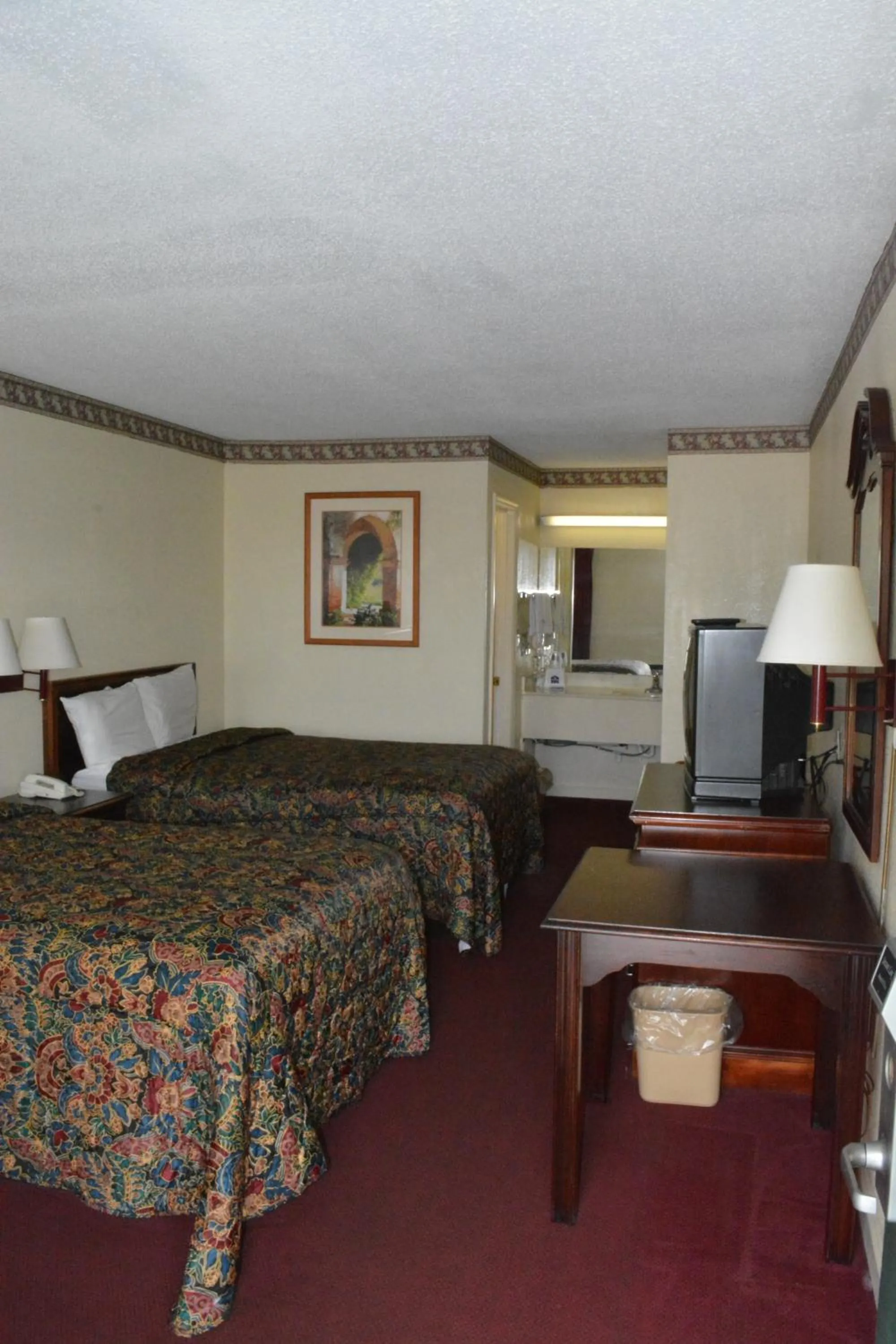 Bed in Knights Inn Hurricane Mills