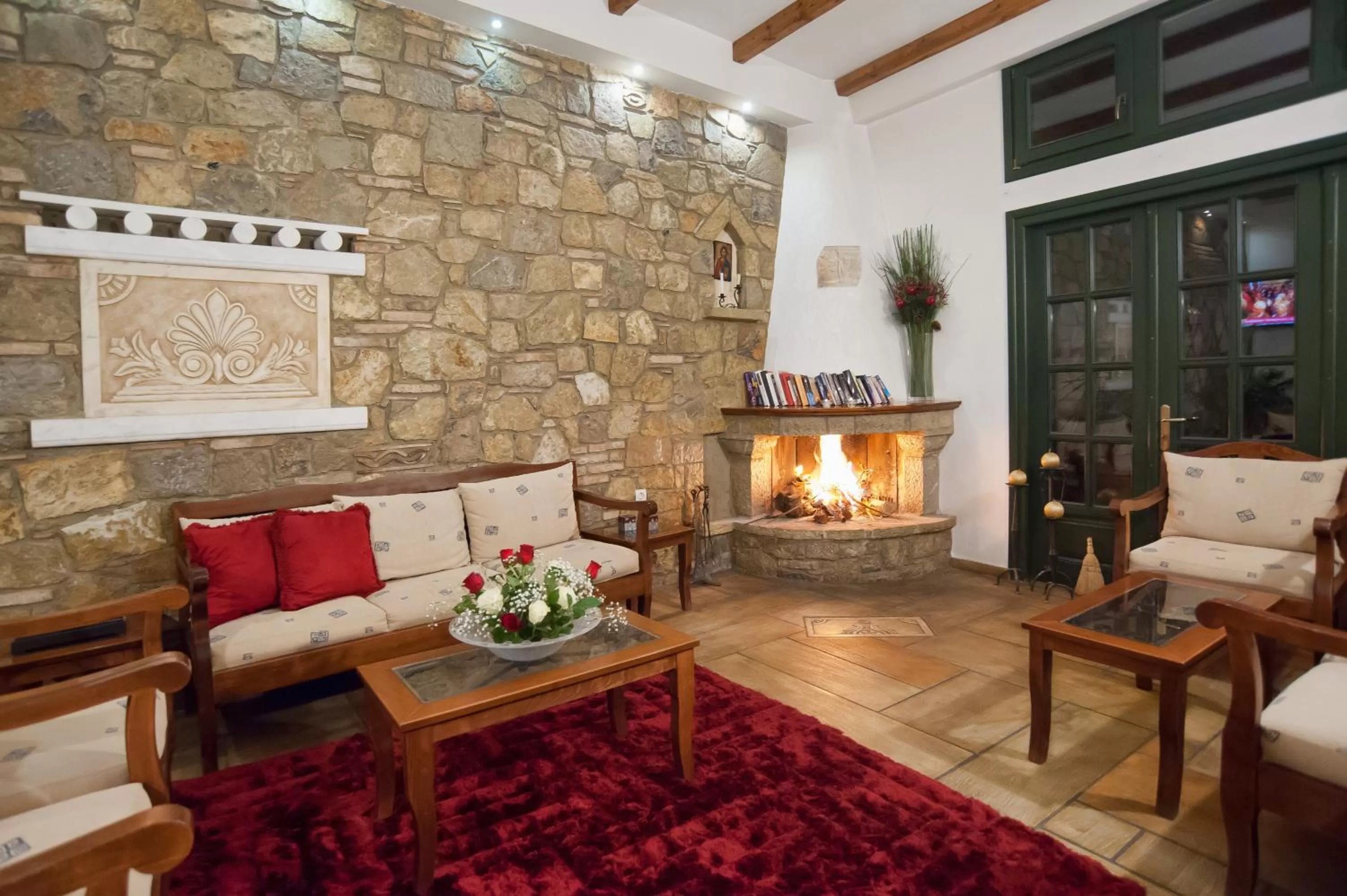 Communal lounge/ TV room in Artemis Hotel