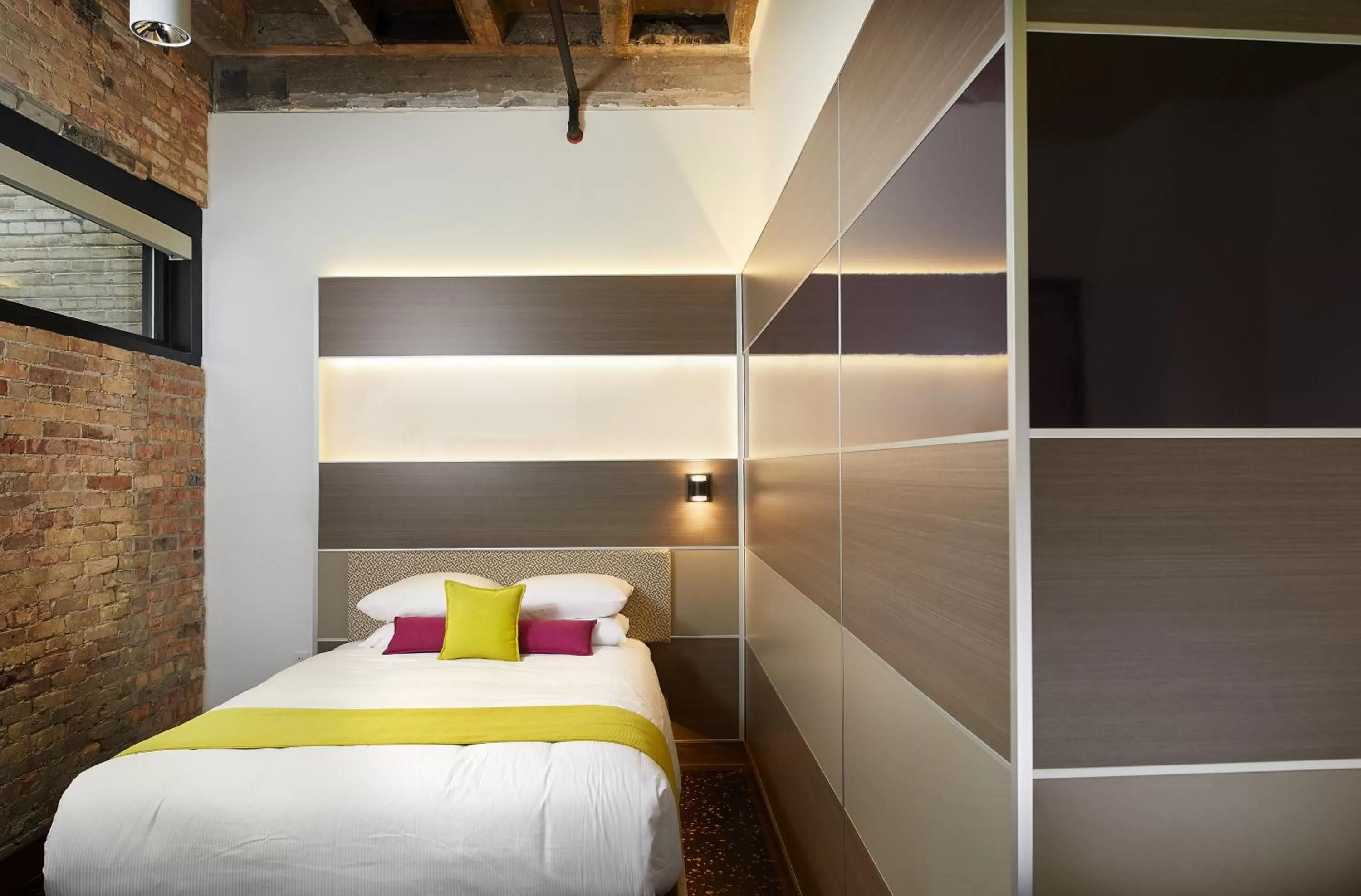 Bed in CityFlatsHotel - Grand Rapids, an Ascend Collection Hotel