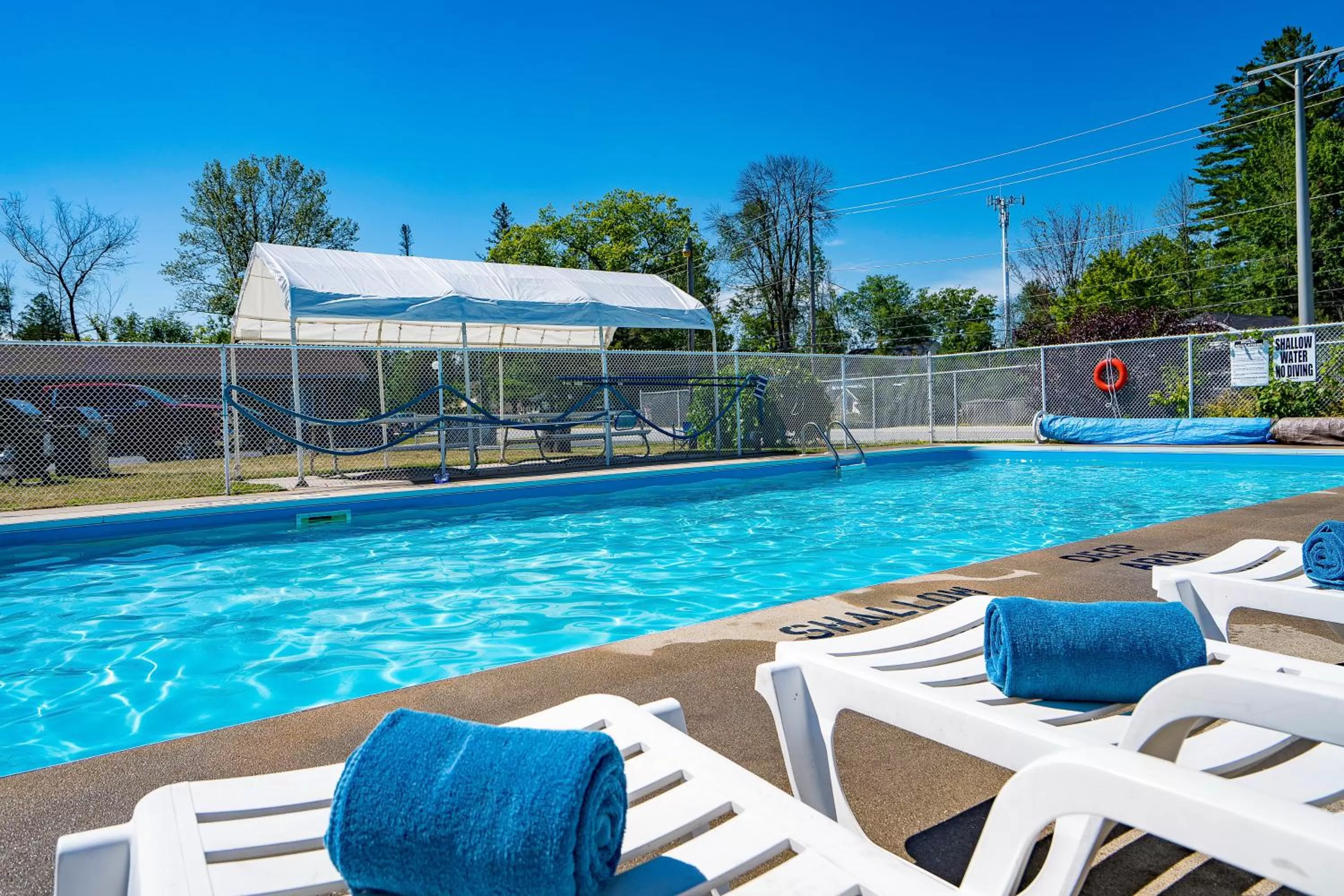Swimming pool in Beach Club by Beach1 Motel
