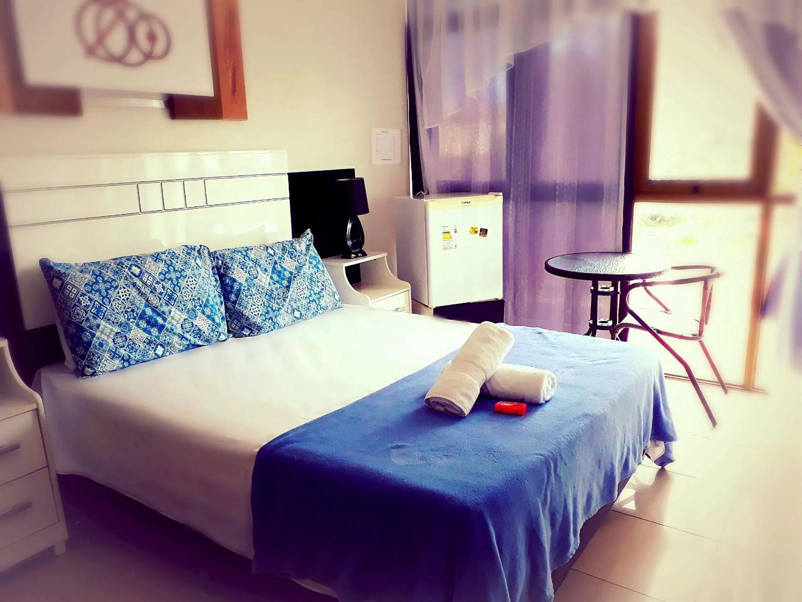 Bed in Pousada Das Palmeiras