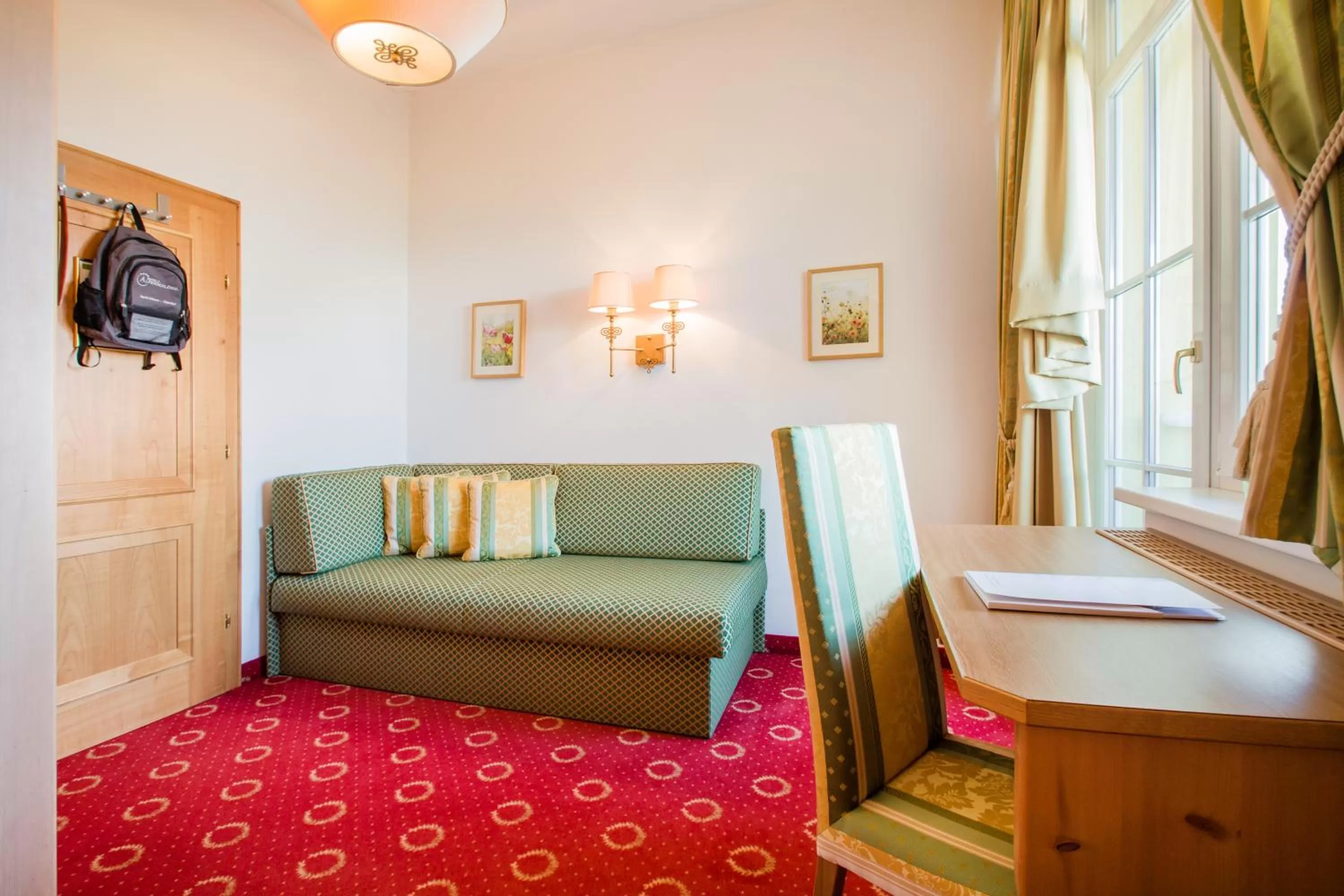 Seating area, Bed in Hotel AlpenSchlössl