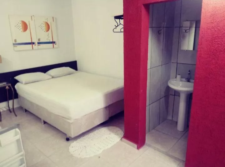 Bed in Pousada Villas