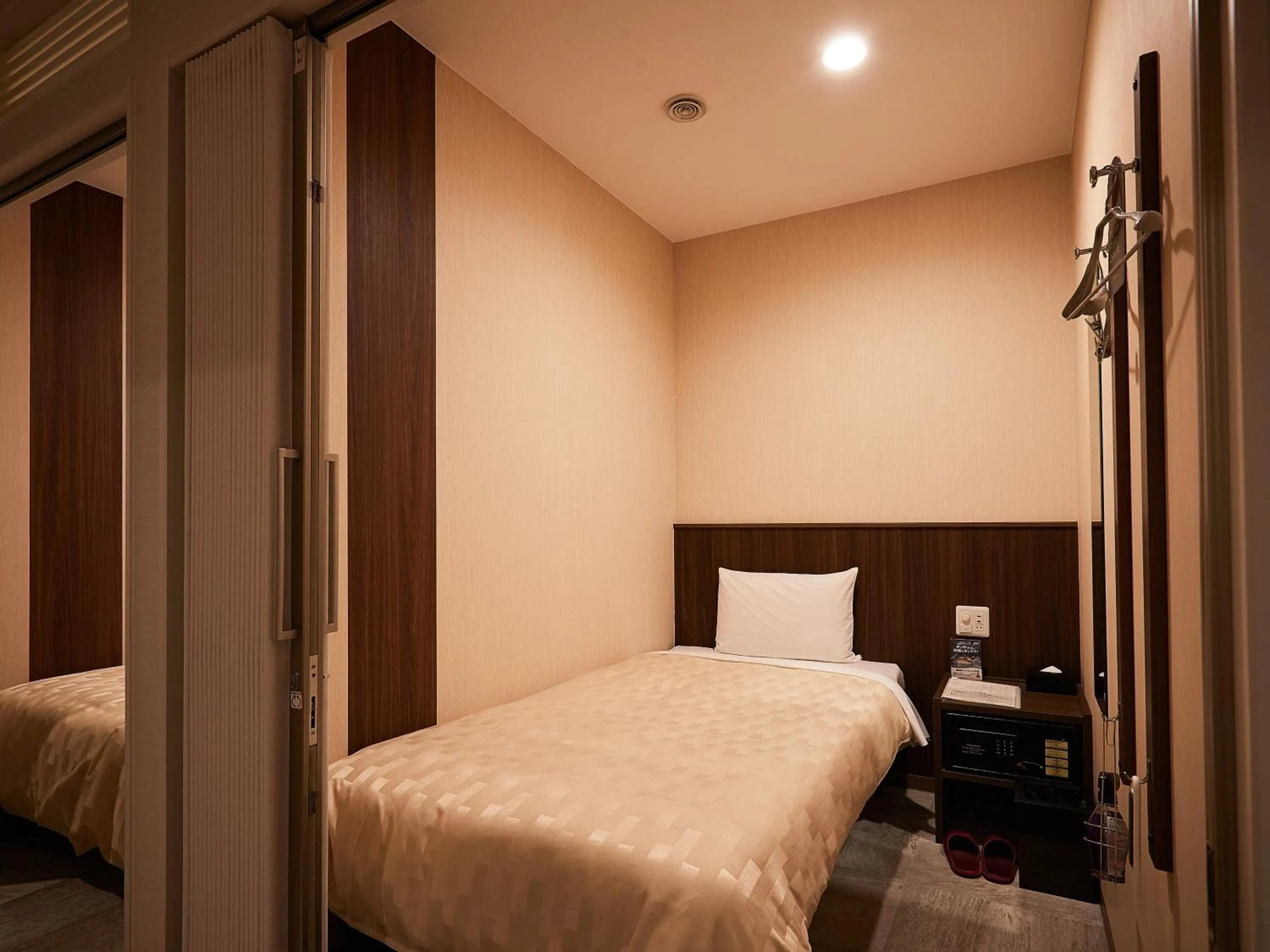 Bed in Grand Cabin Hotel Naha Oroku