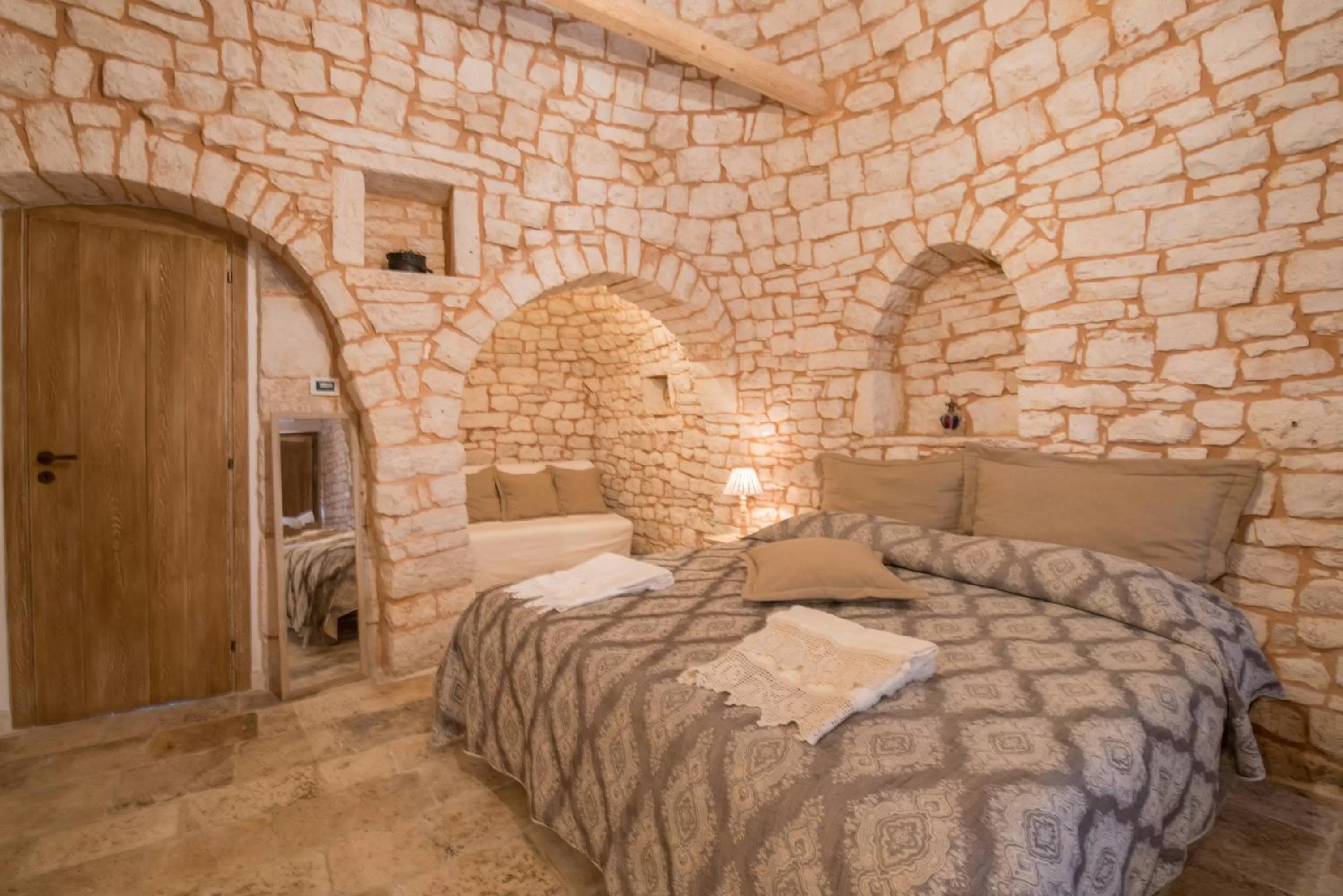 Bed in Trulli Antichi Mestieri - Widespread Trulli in the historic center